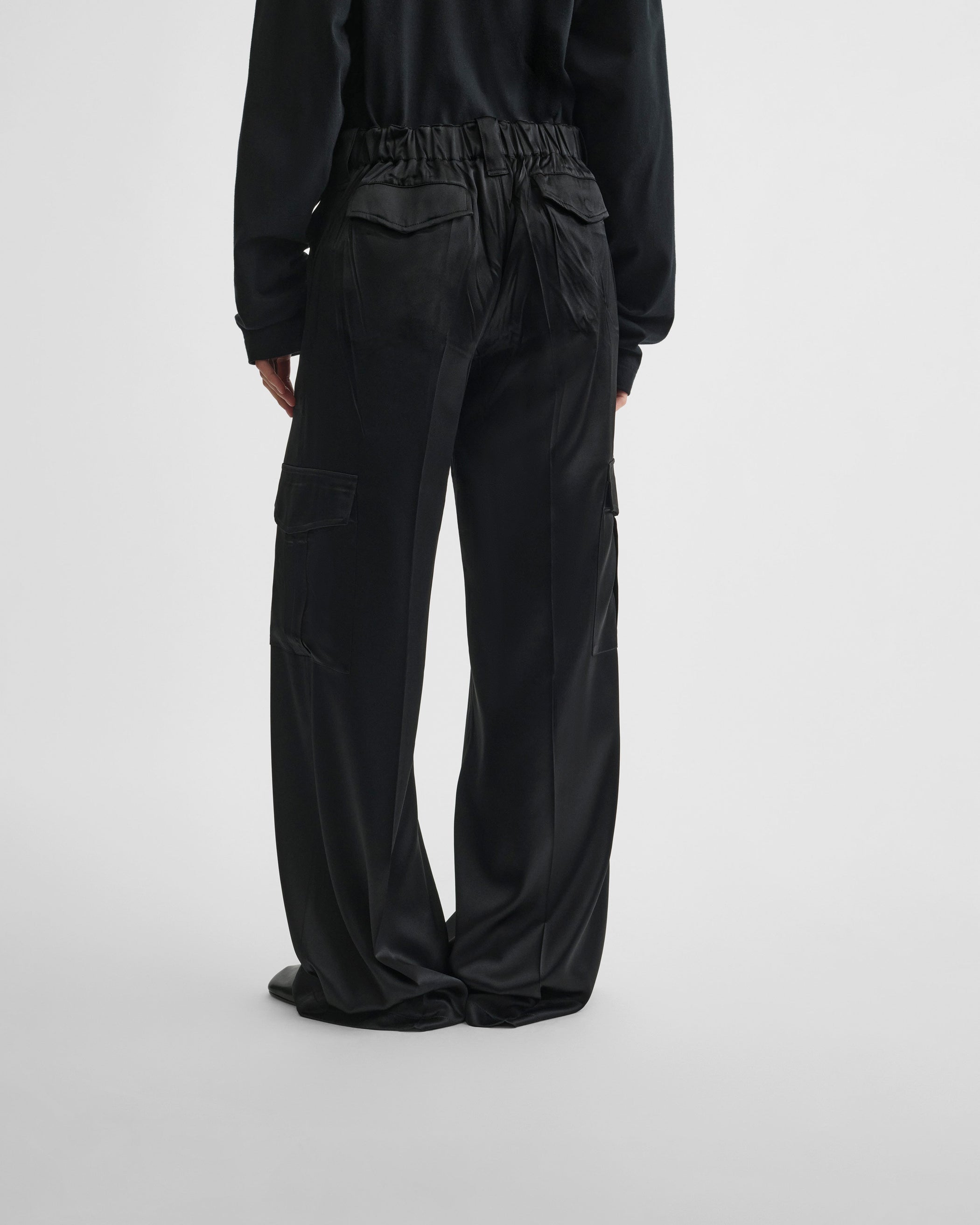 View of liquid cargo trousers in black silk