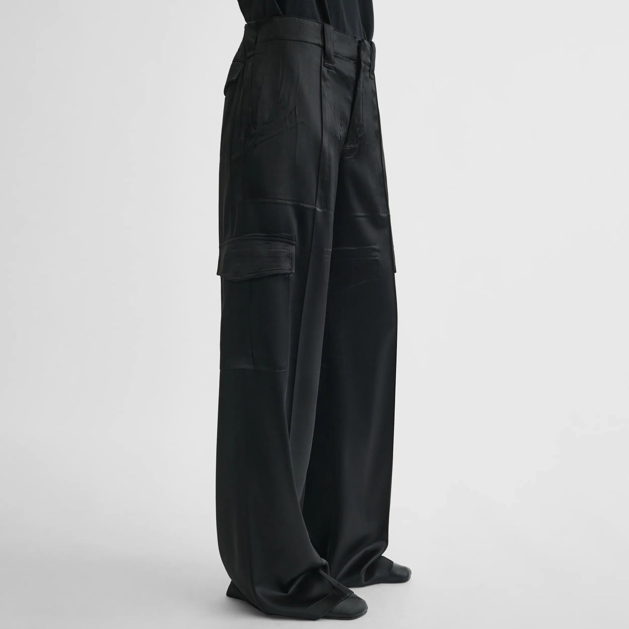Side view of liquid cargo trousers in black silk