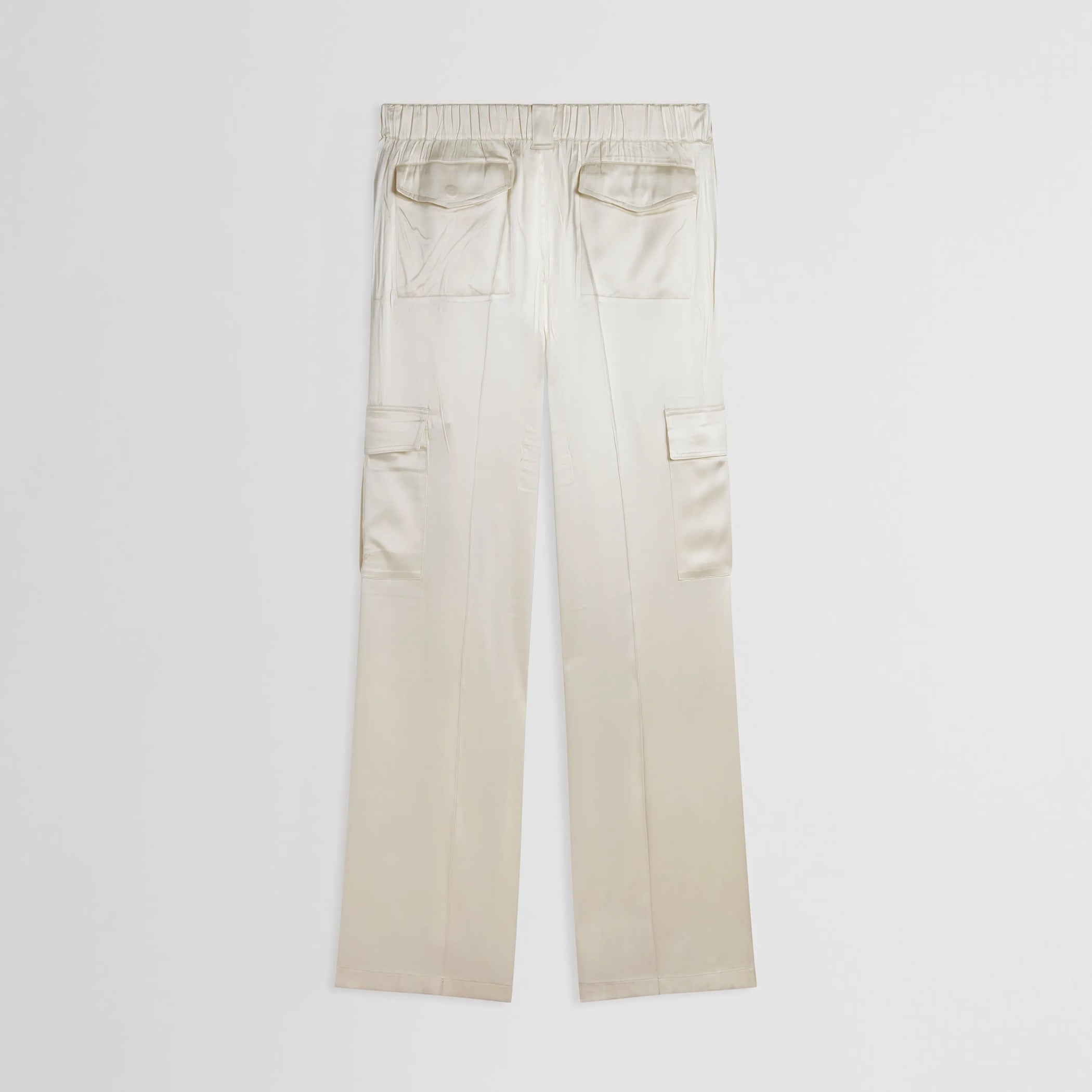 Flat back view of liquid cargo trousers in cream silk satin.