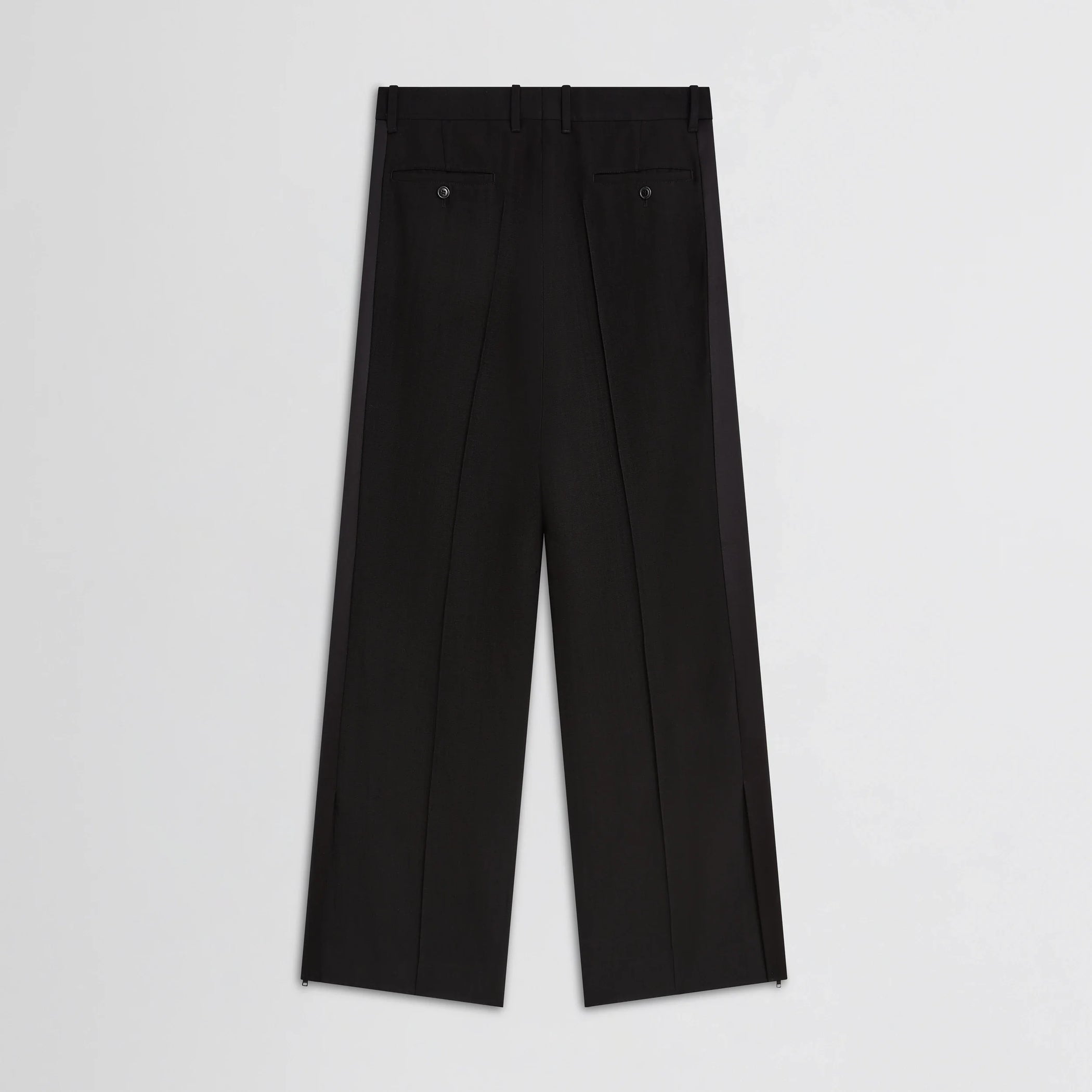 Flat back view of split tux trousers in black wool.