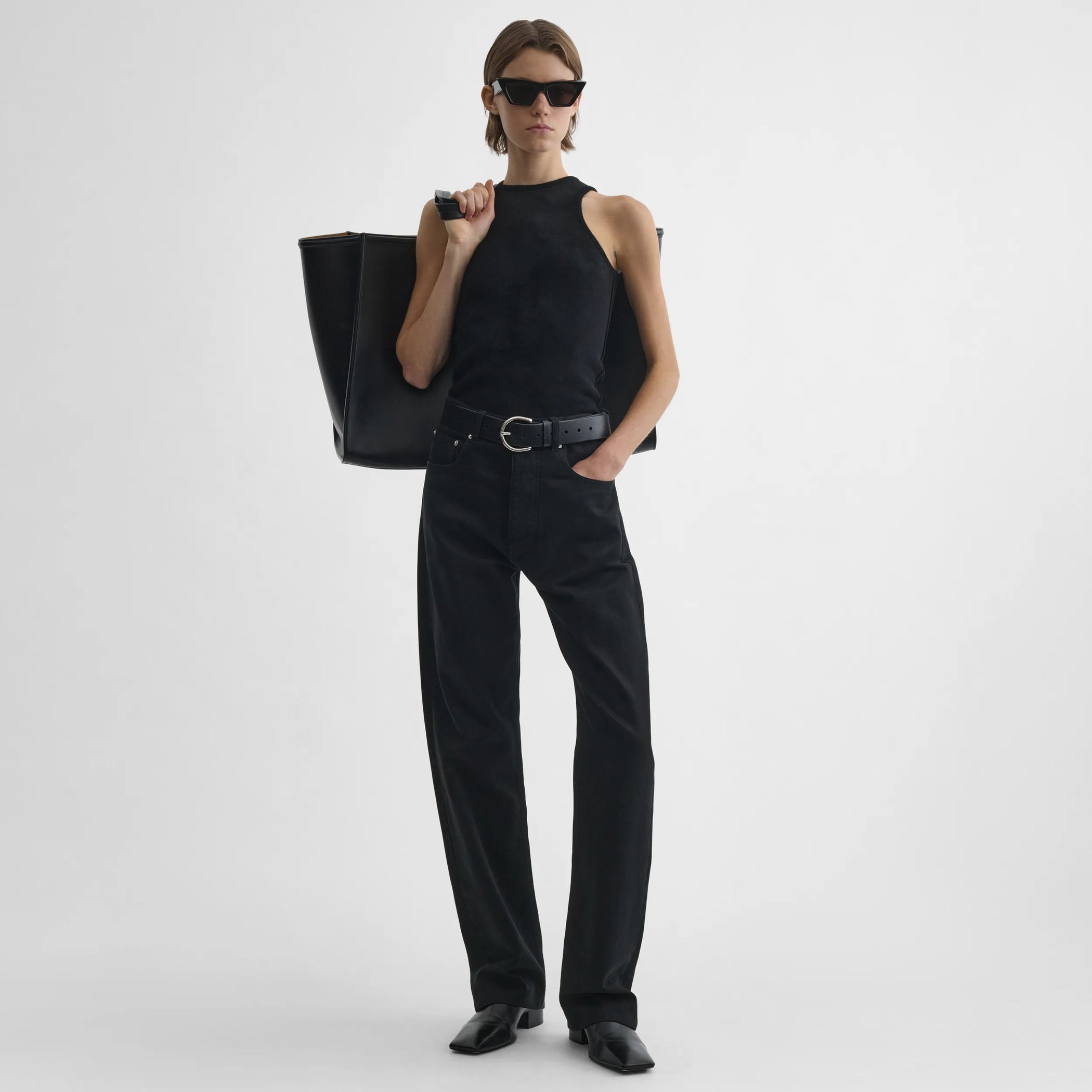 Full body front view of model wearing Classic Jeans in black.