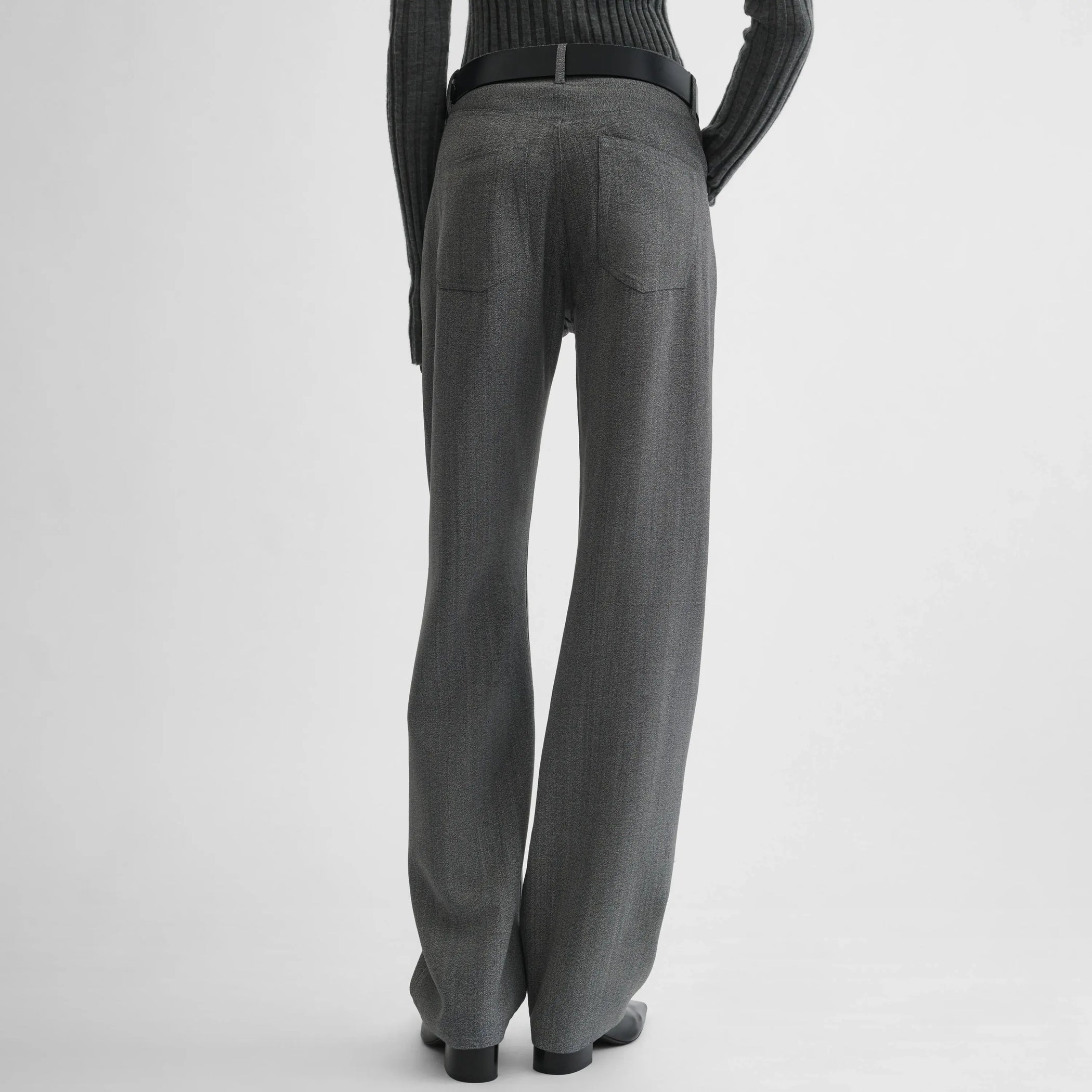 Back view of model wearing classic jeans in mist