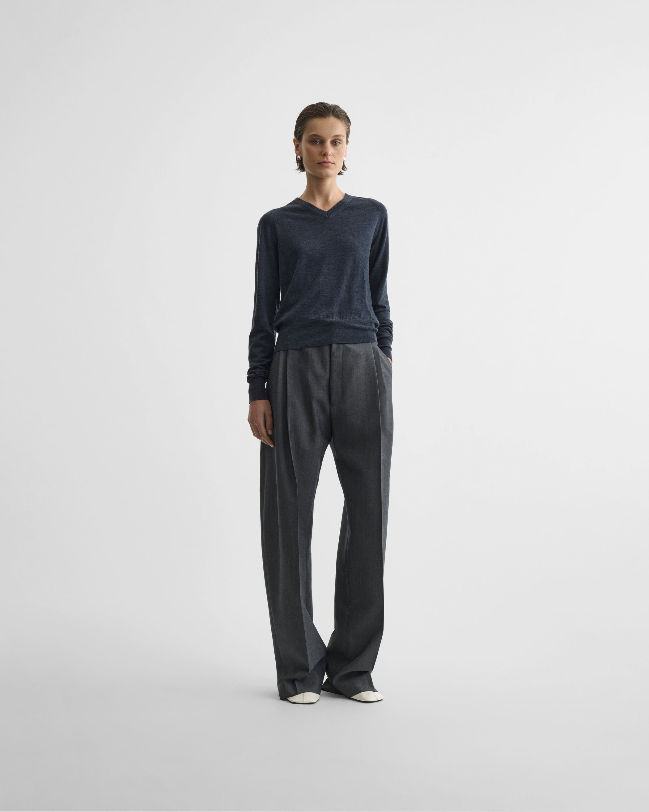 View of double pleat trousers in grey mélange wool