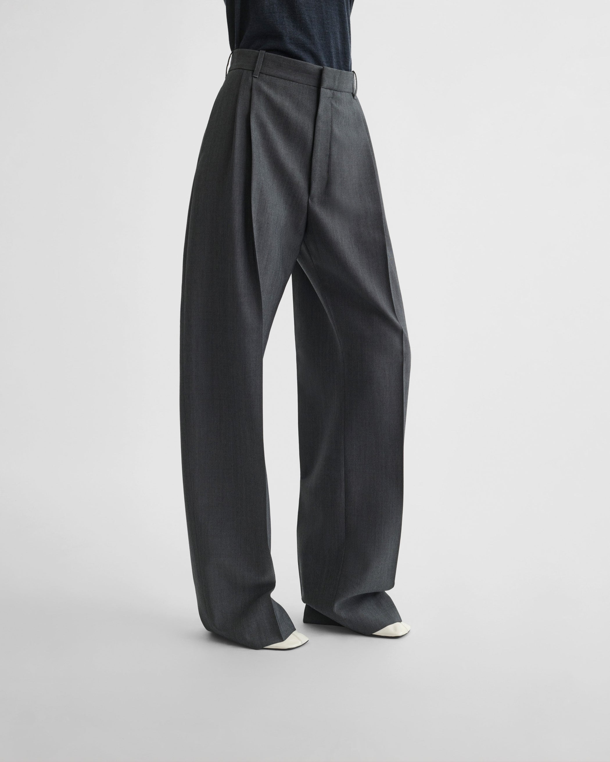 View of double pleat trousers in grey mélange wool
