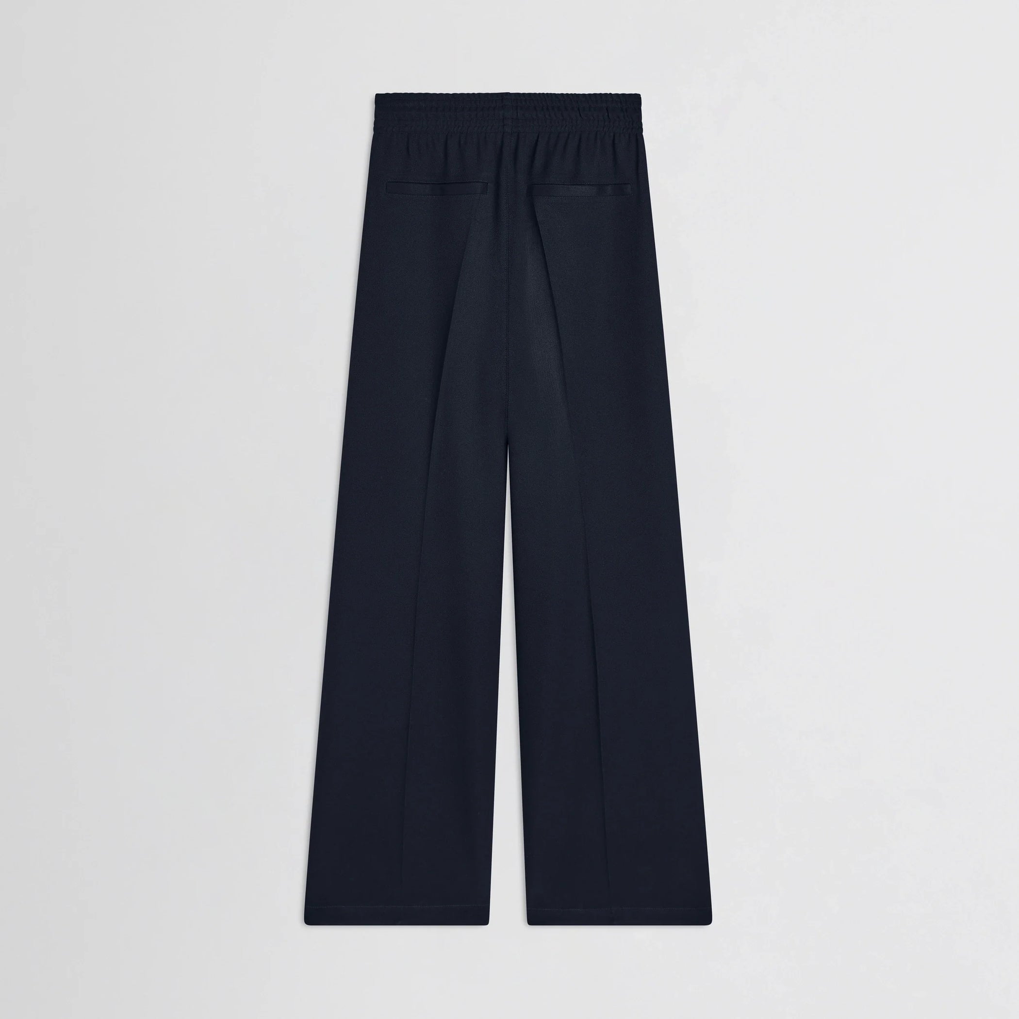 Flat back view of track trousers in navy polyester.