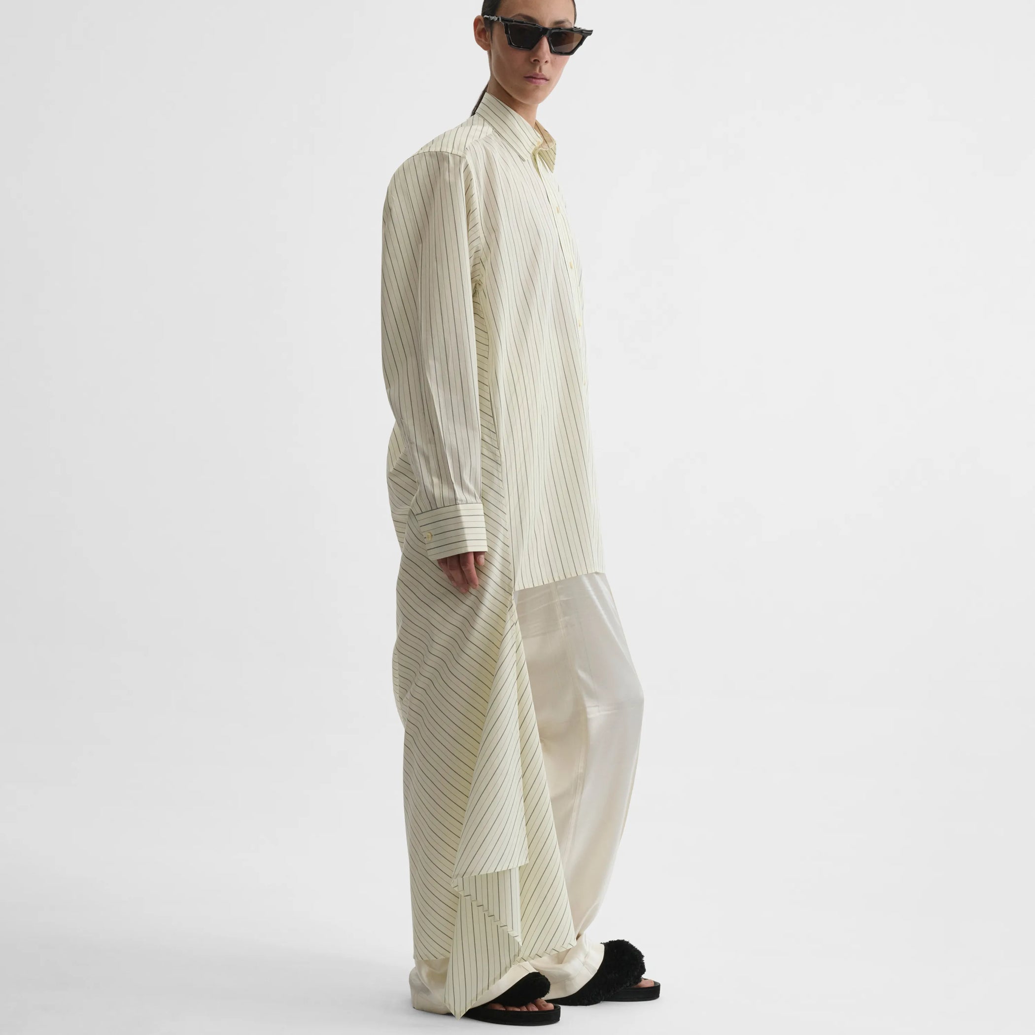 Side view of dropped front shirt in pale lemon cotton