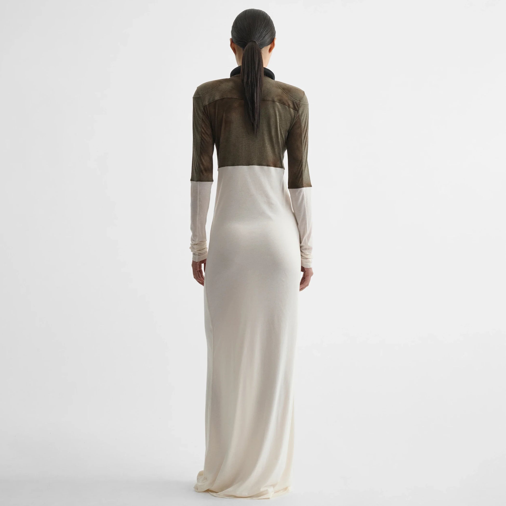 Back view of model wearing tubular liner dress in tobacco ivory cotton.