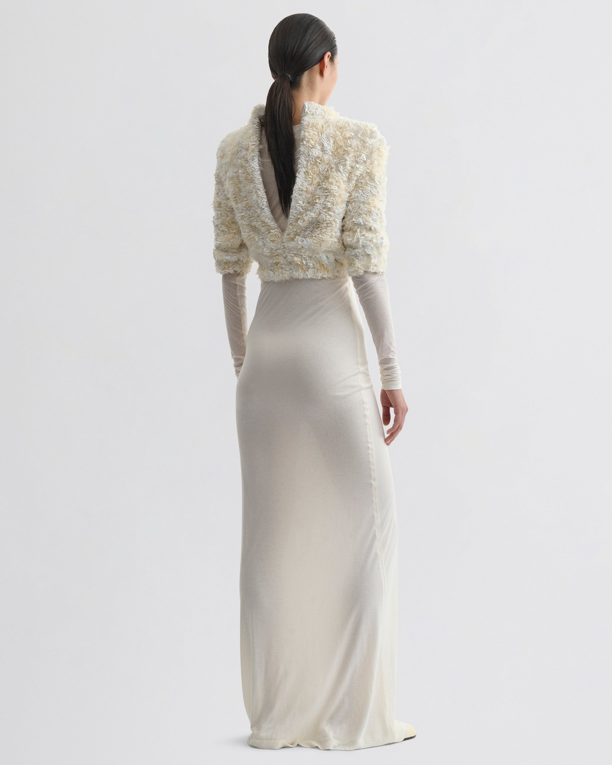 Back view of model wearing CLUSTERED SEQUIN DRESS in ivory jersey