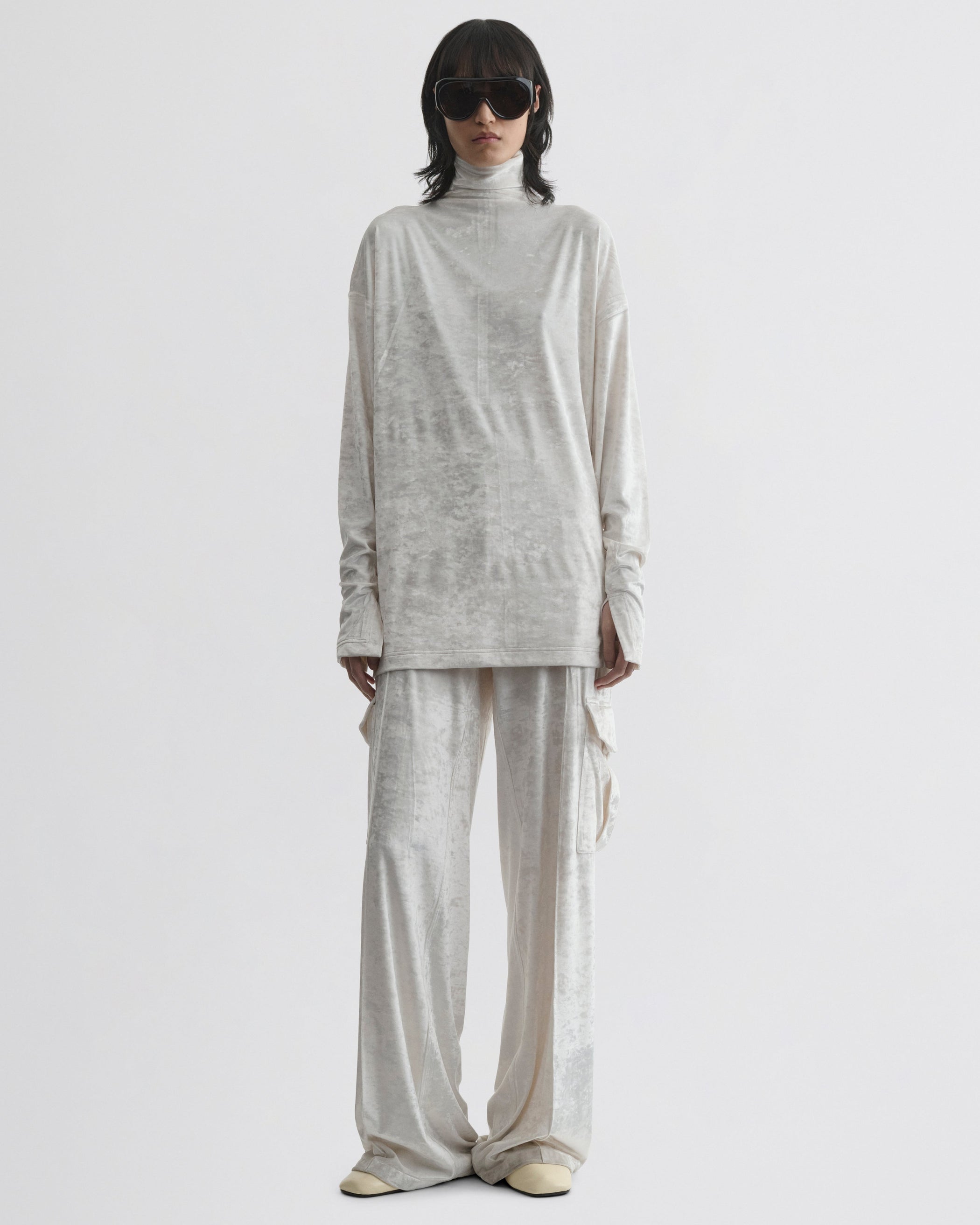 Front view of model wearing LIQUID HIGH NECK TOP in white crushed velvet