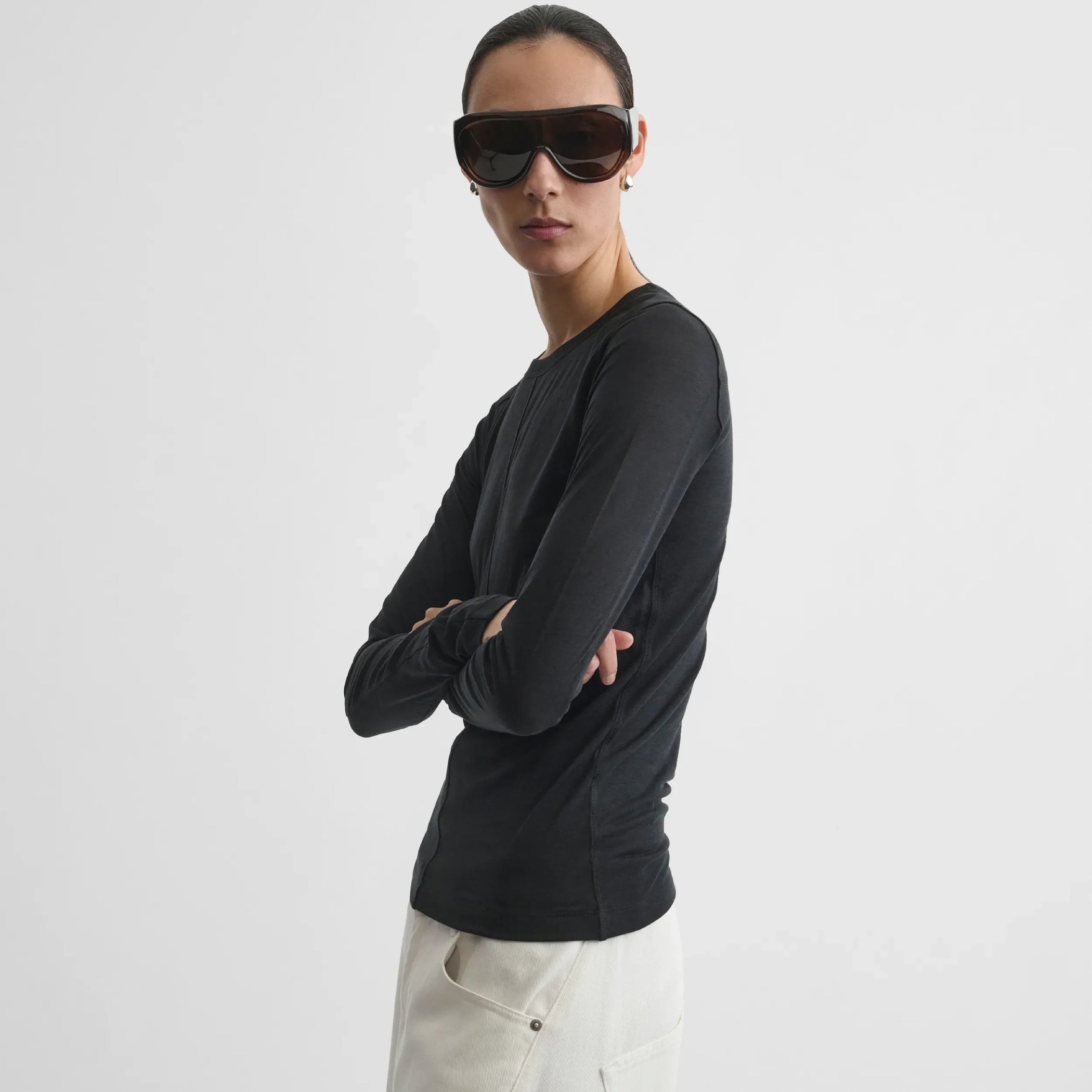 Side view of crewneck top in black cotton