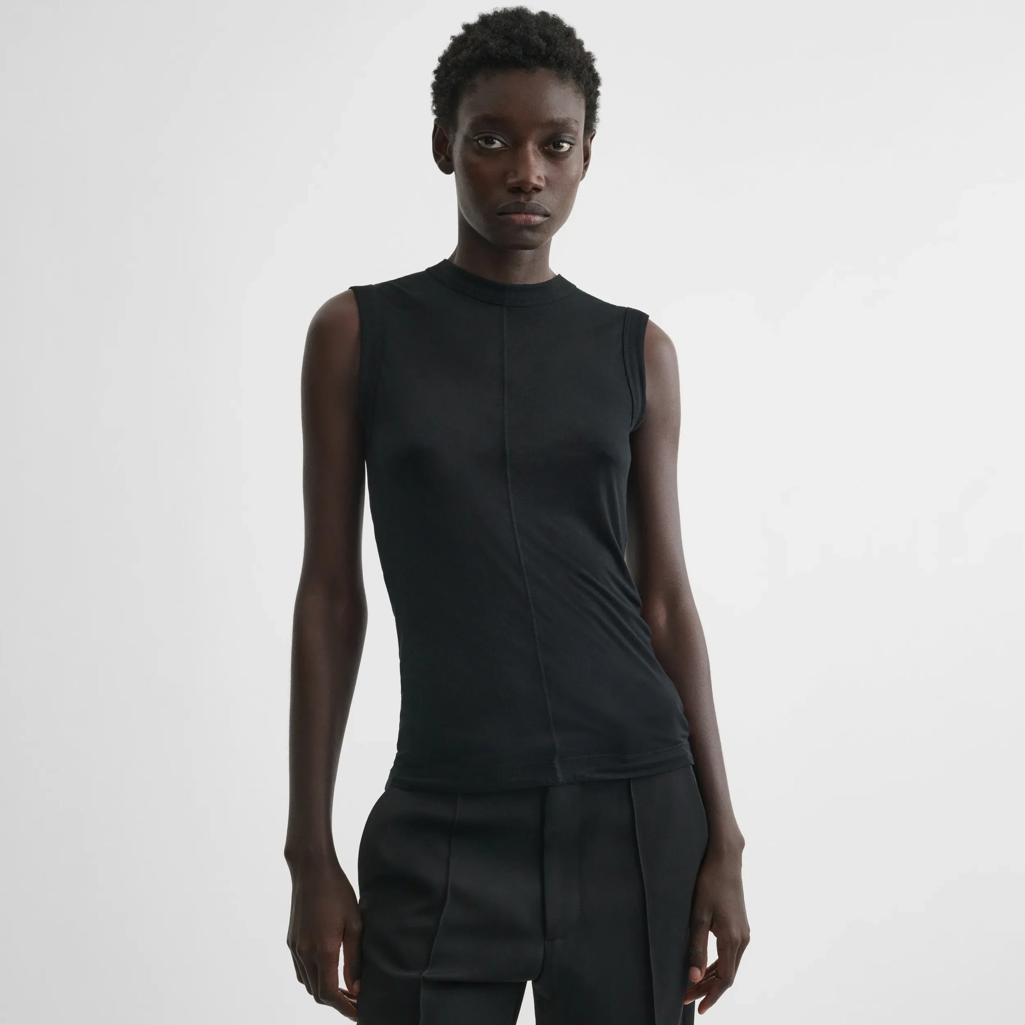 Front view of underpinning tank top in black cotton