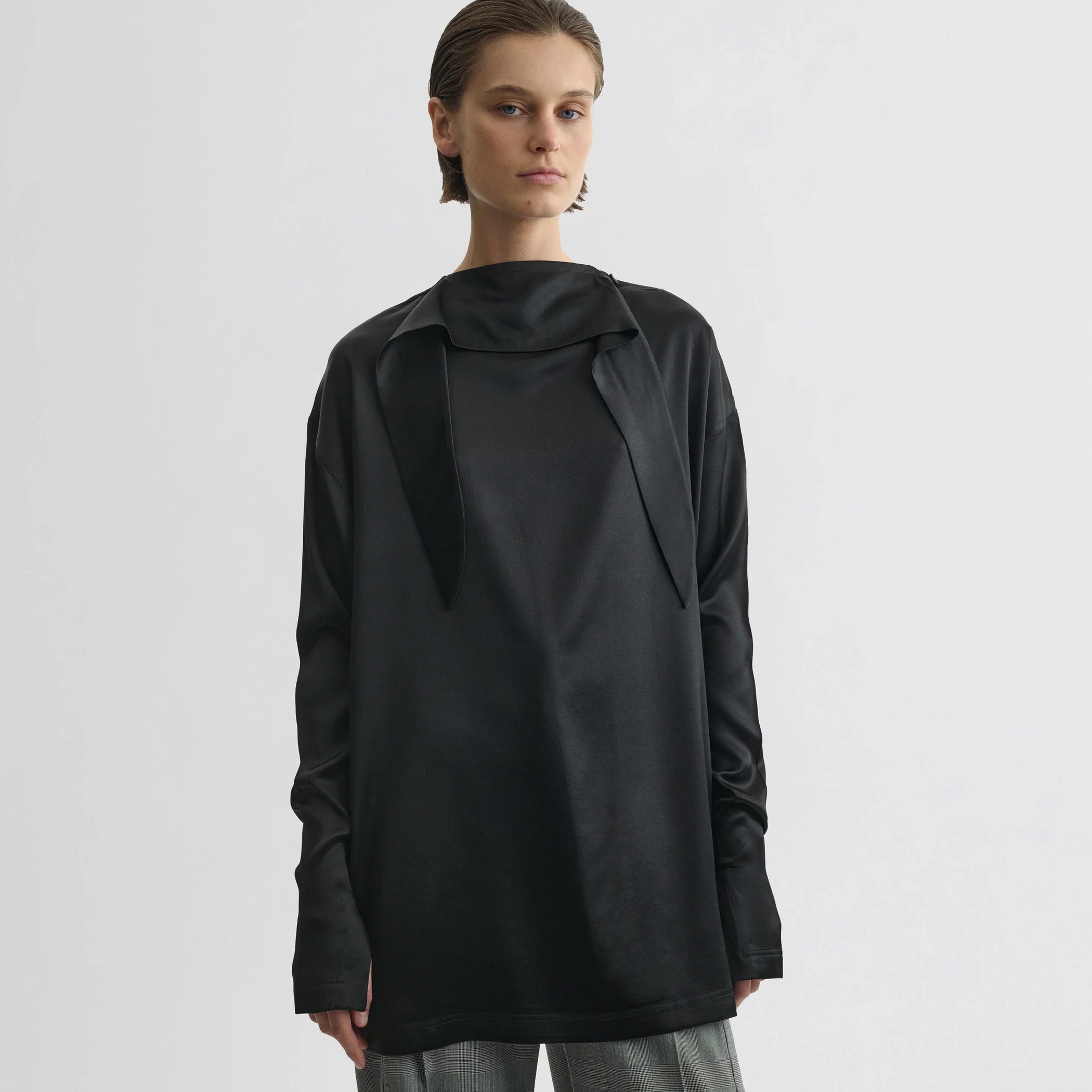 Front view of liquid knot collar top in black silk.