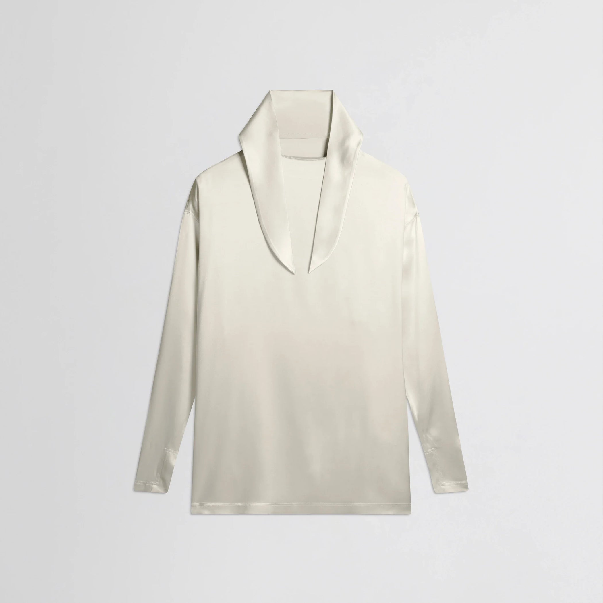 Flat front view of liquid knot collar top in cream silk.