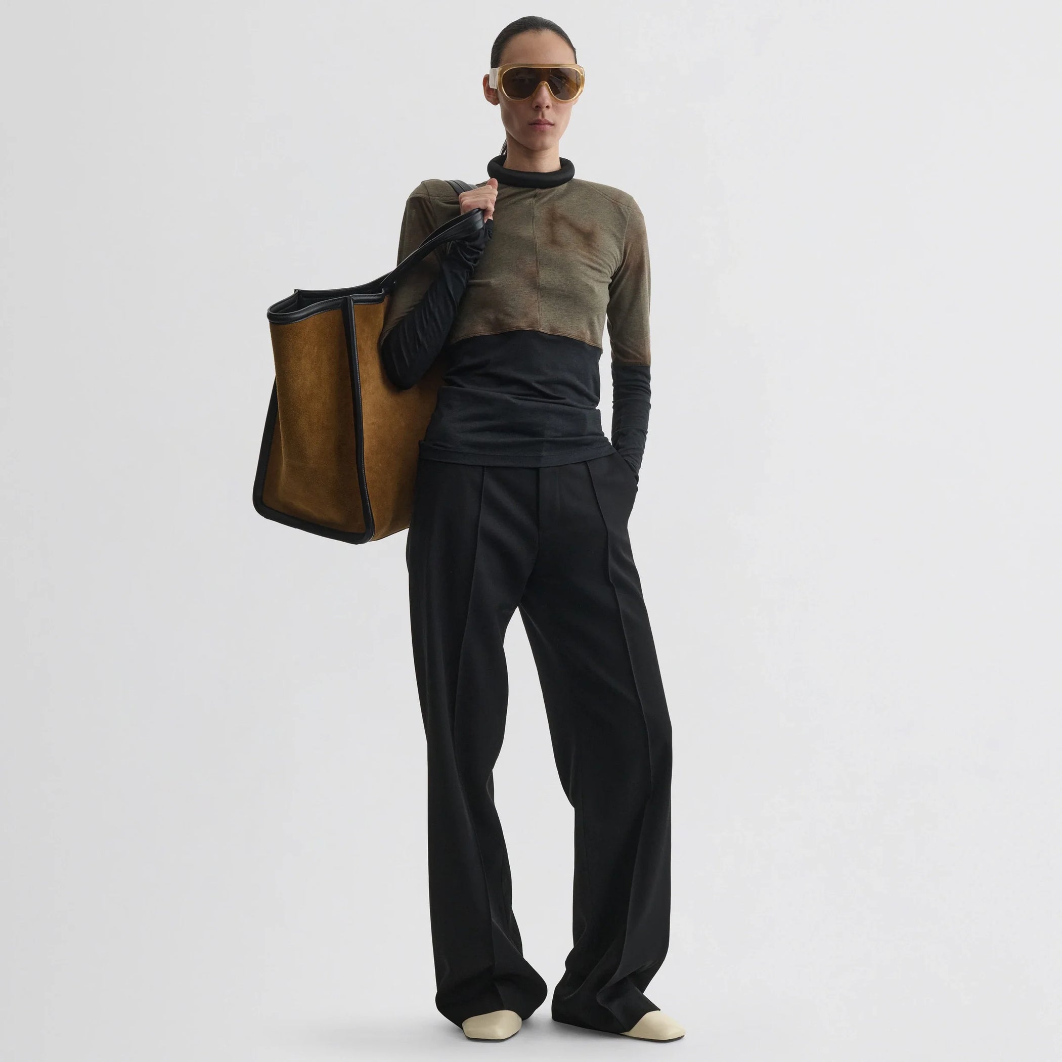 Front view of model wearing tubular top in tobacco black cotton.