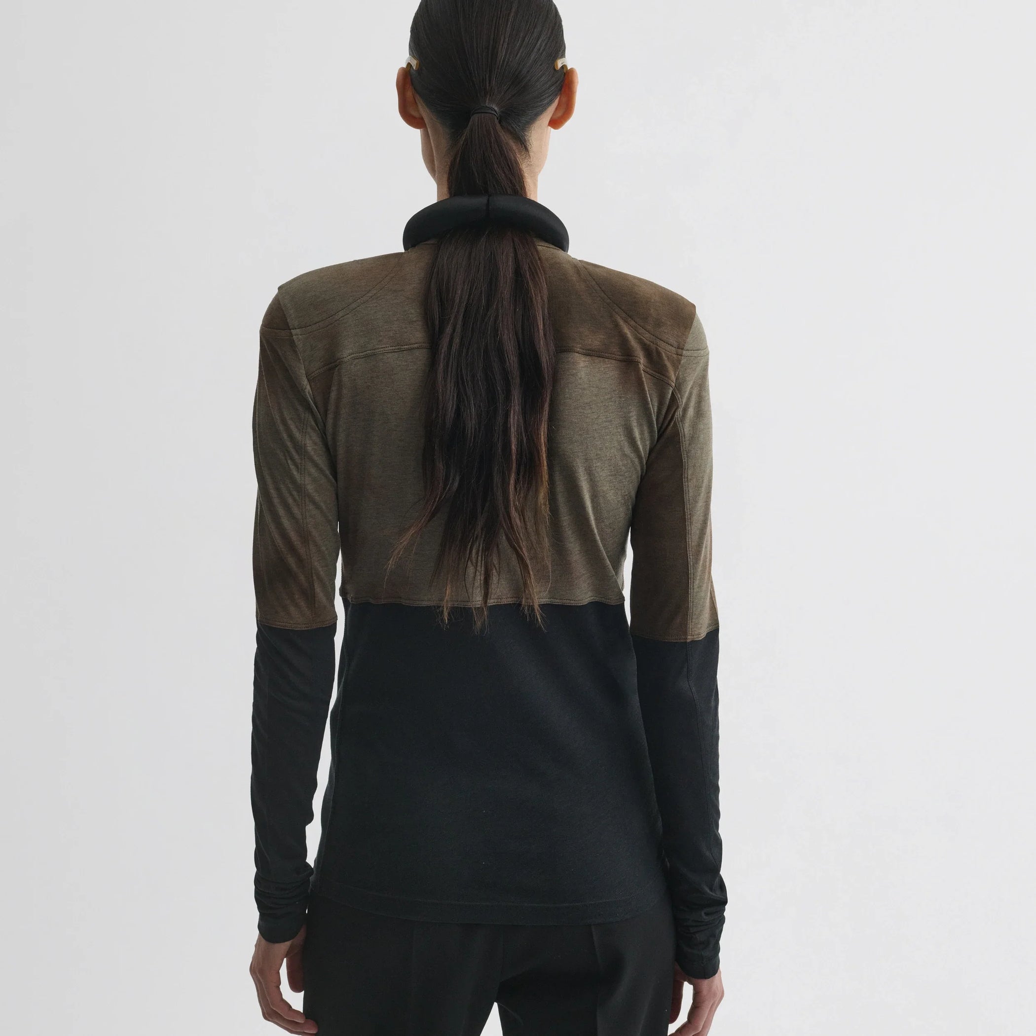 Back view of model wearing tubular top in tobacco black cotton.