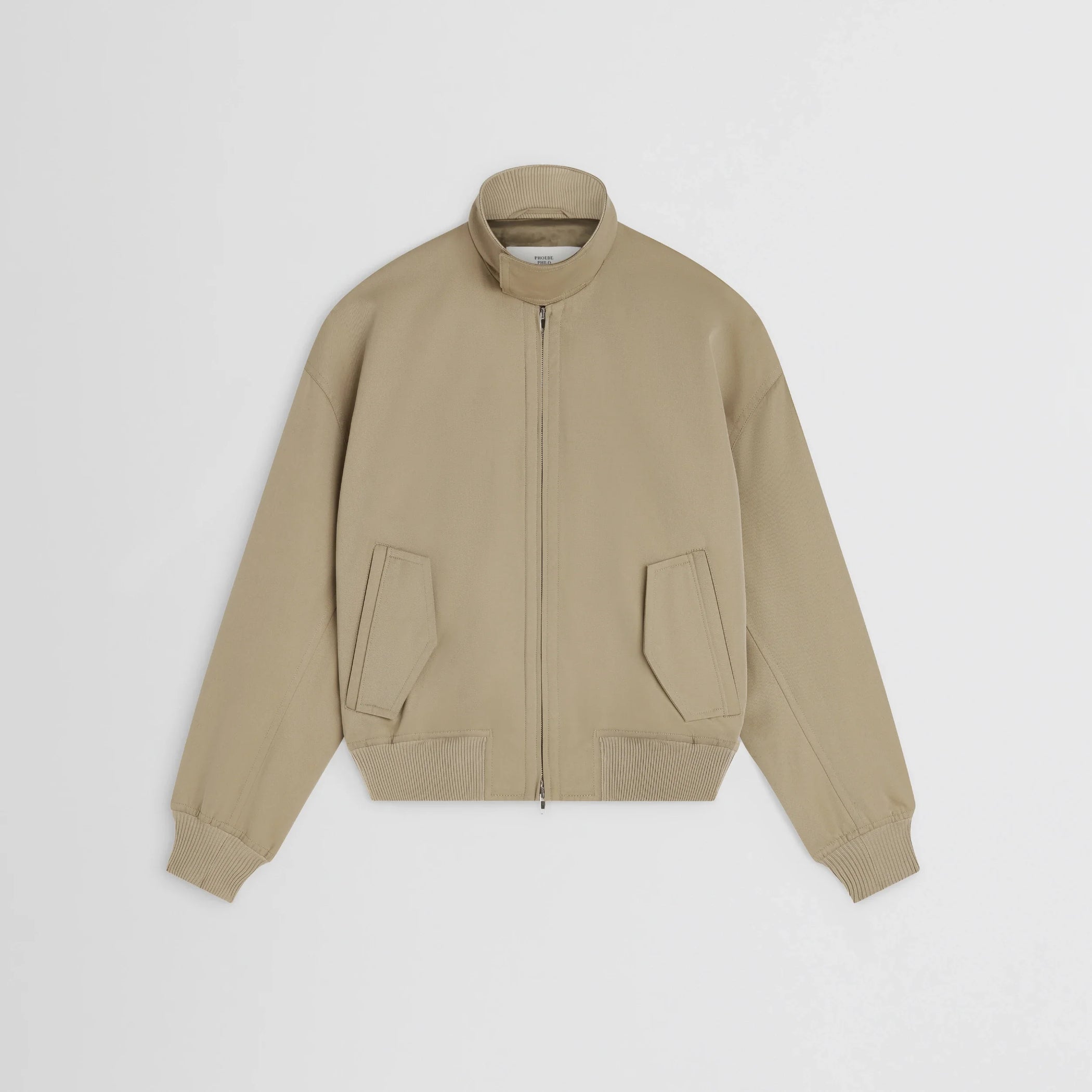 Flat front view of golf jacket in trench cotton.