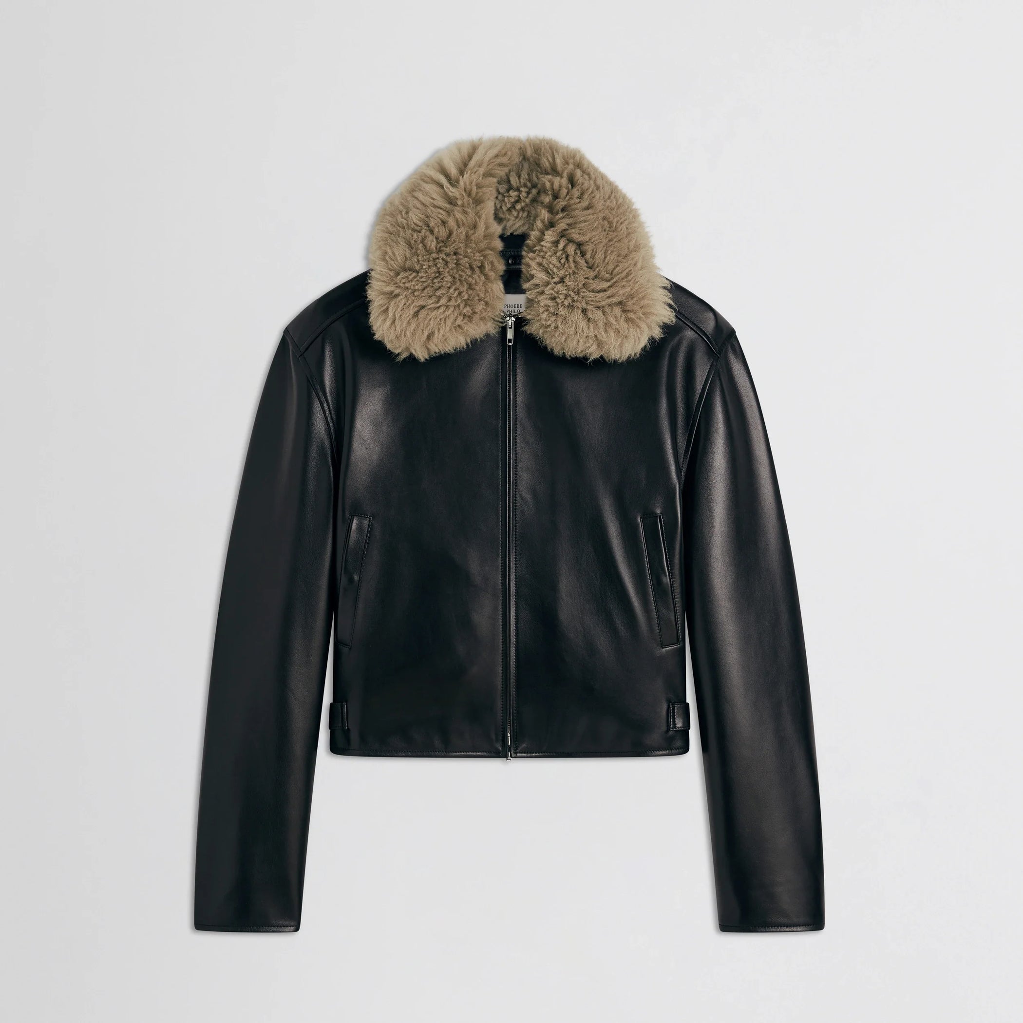 Flat front view of cropped aviator jacket in black leather.