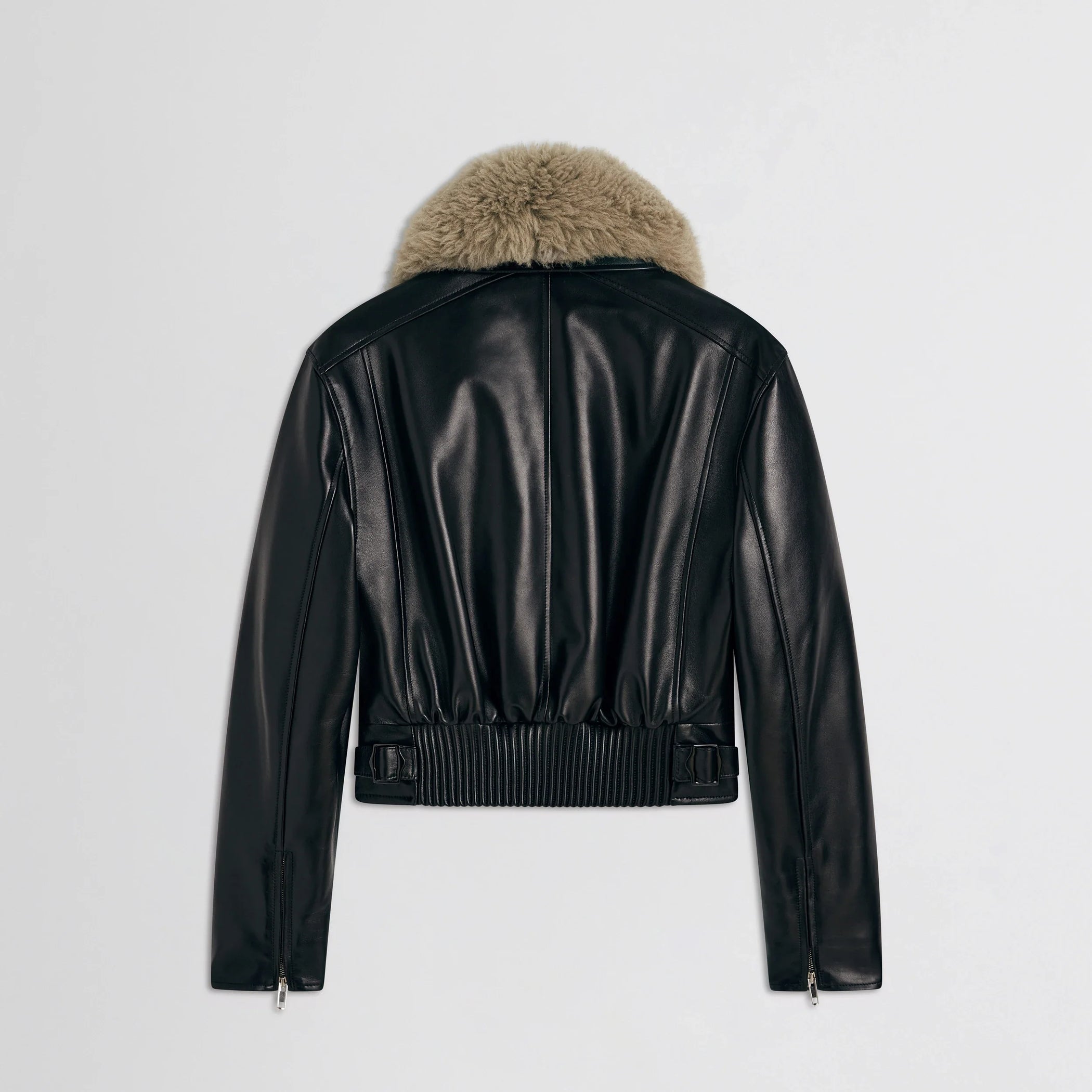 Flat back view of cropped aviator jacket in black leather.