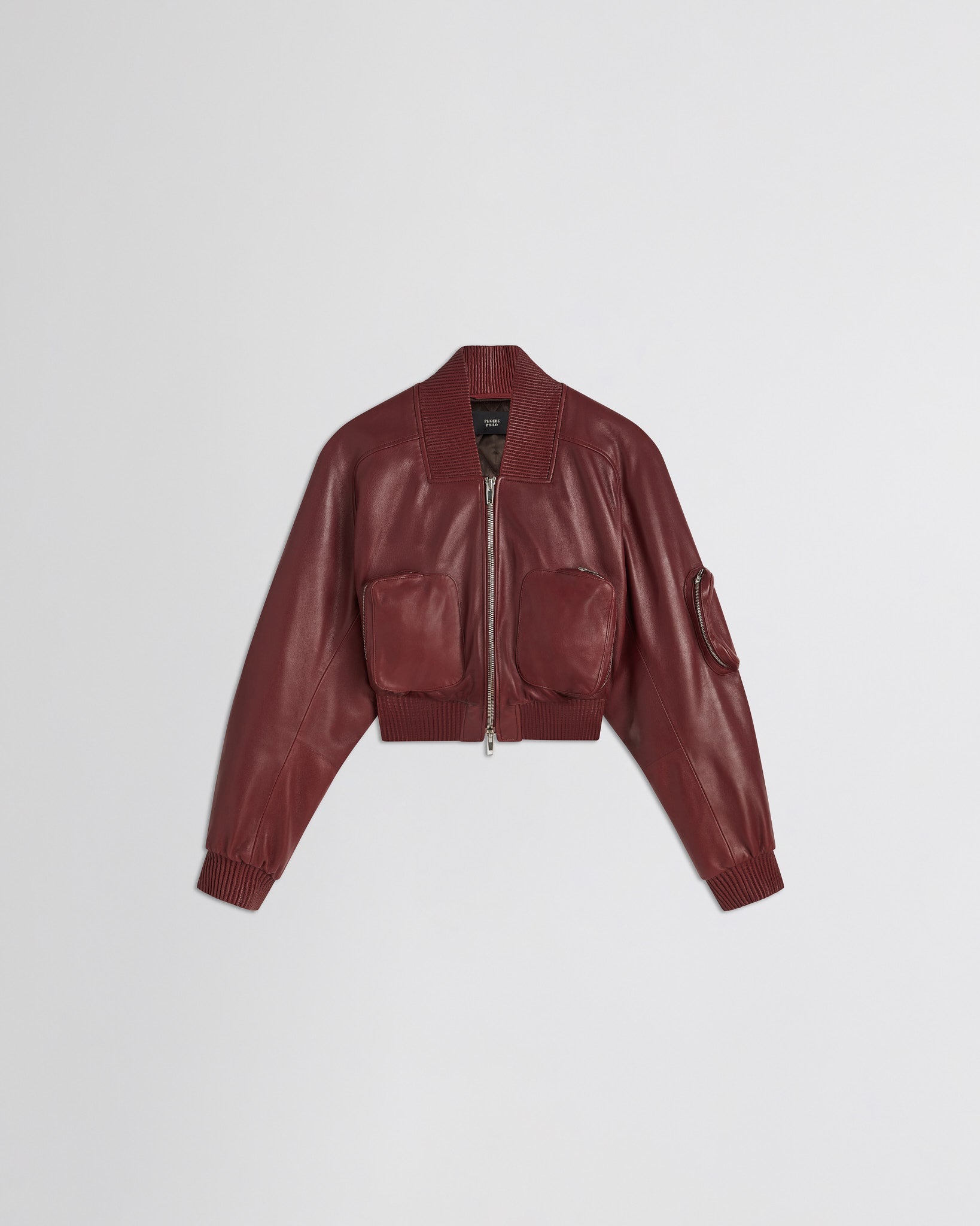 Flat front view of pocket bomber jacket in brick leather