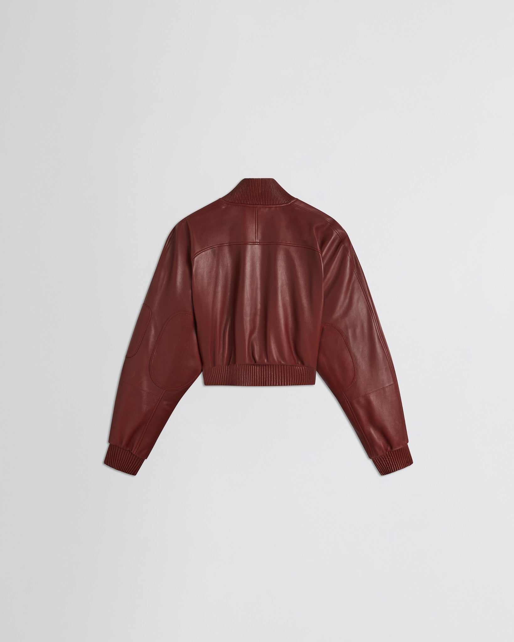 Flat back view of pocket bomber jacket in brick leather