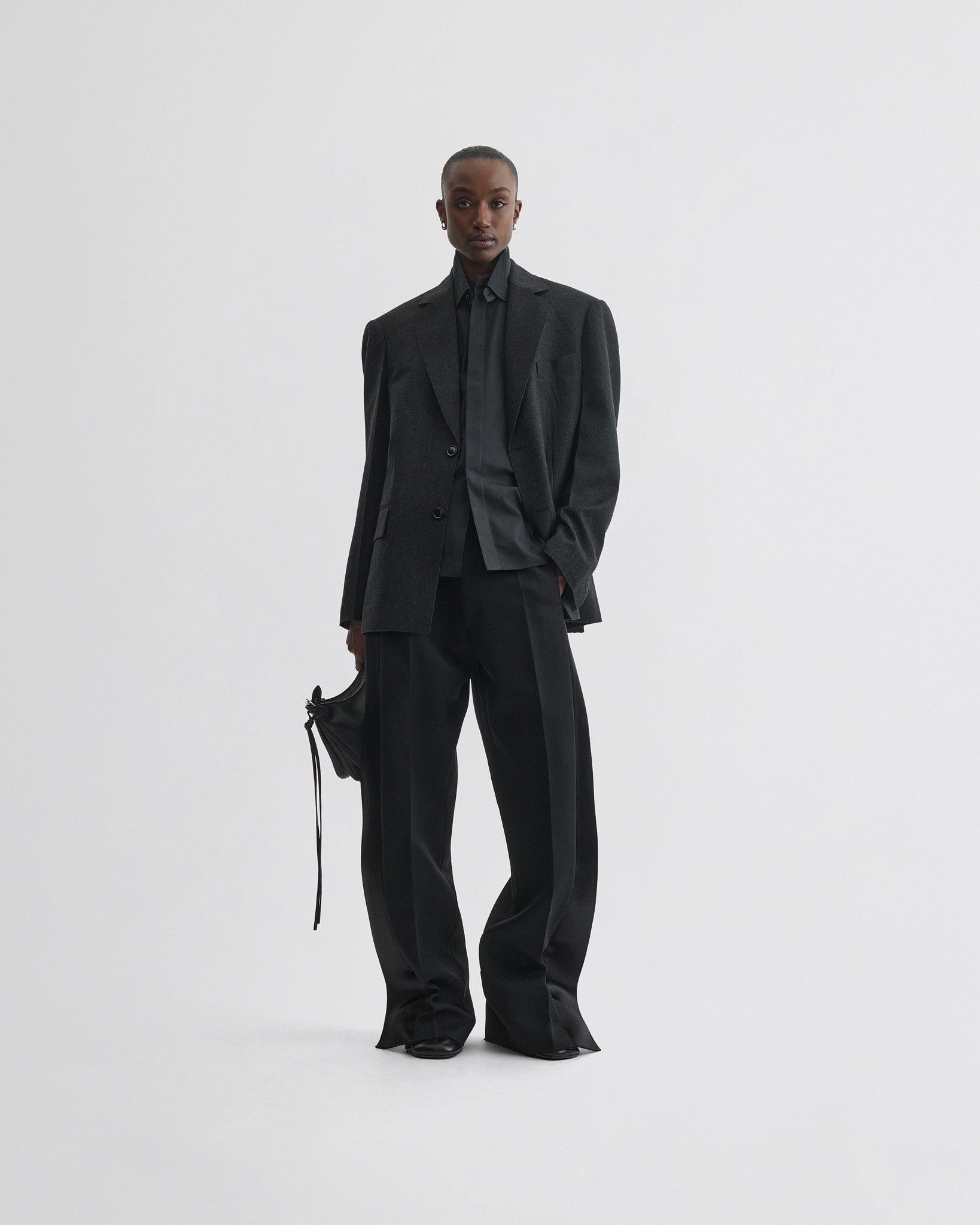 Front view of model wearing Tuxedo Jacket in anthracite wool