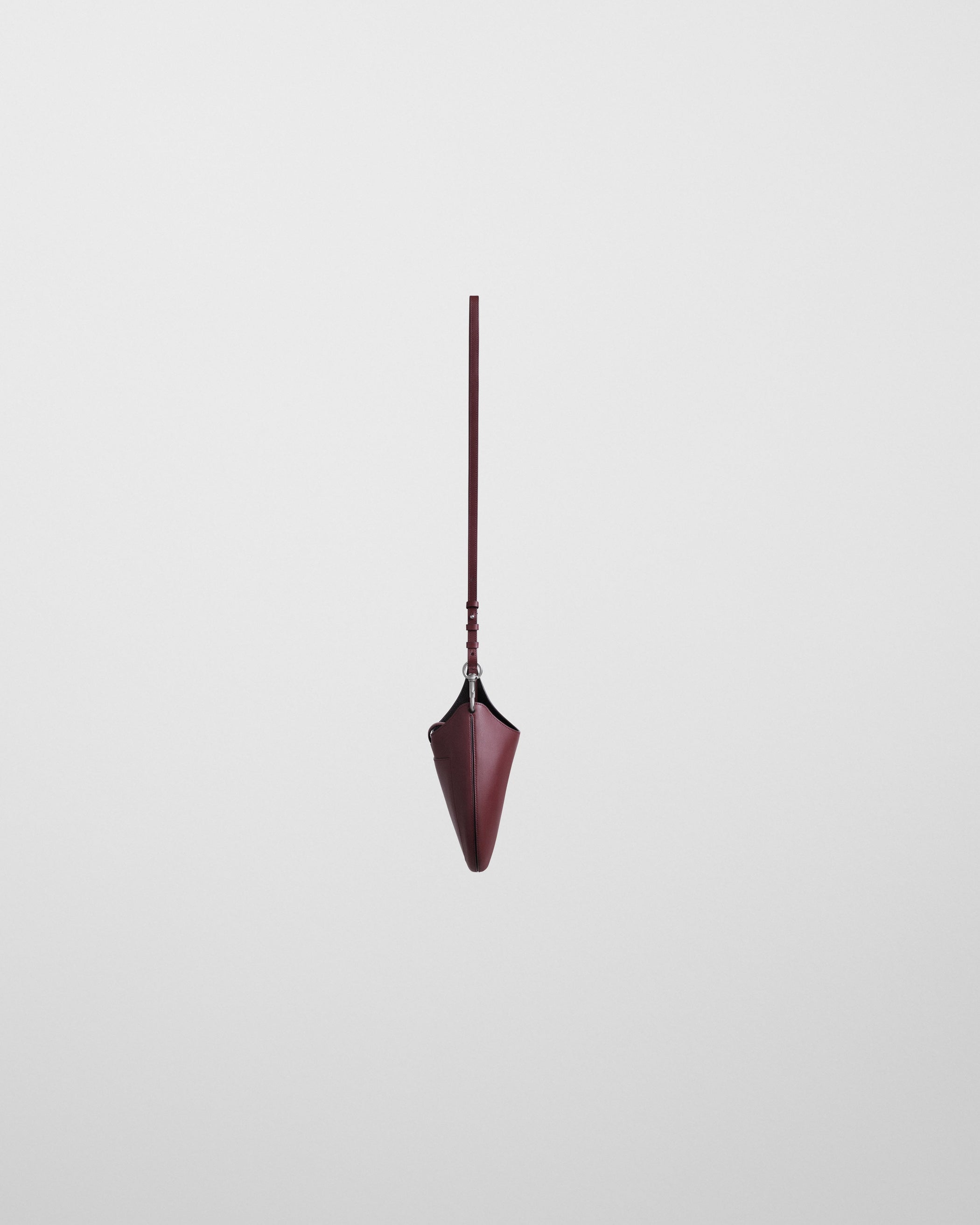 Side view of MINI BEAN SLING in chestnut leather