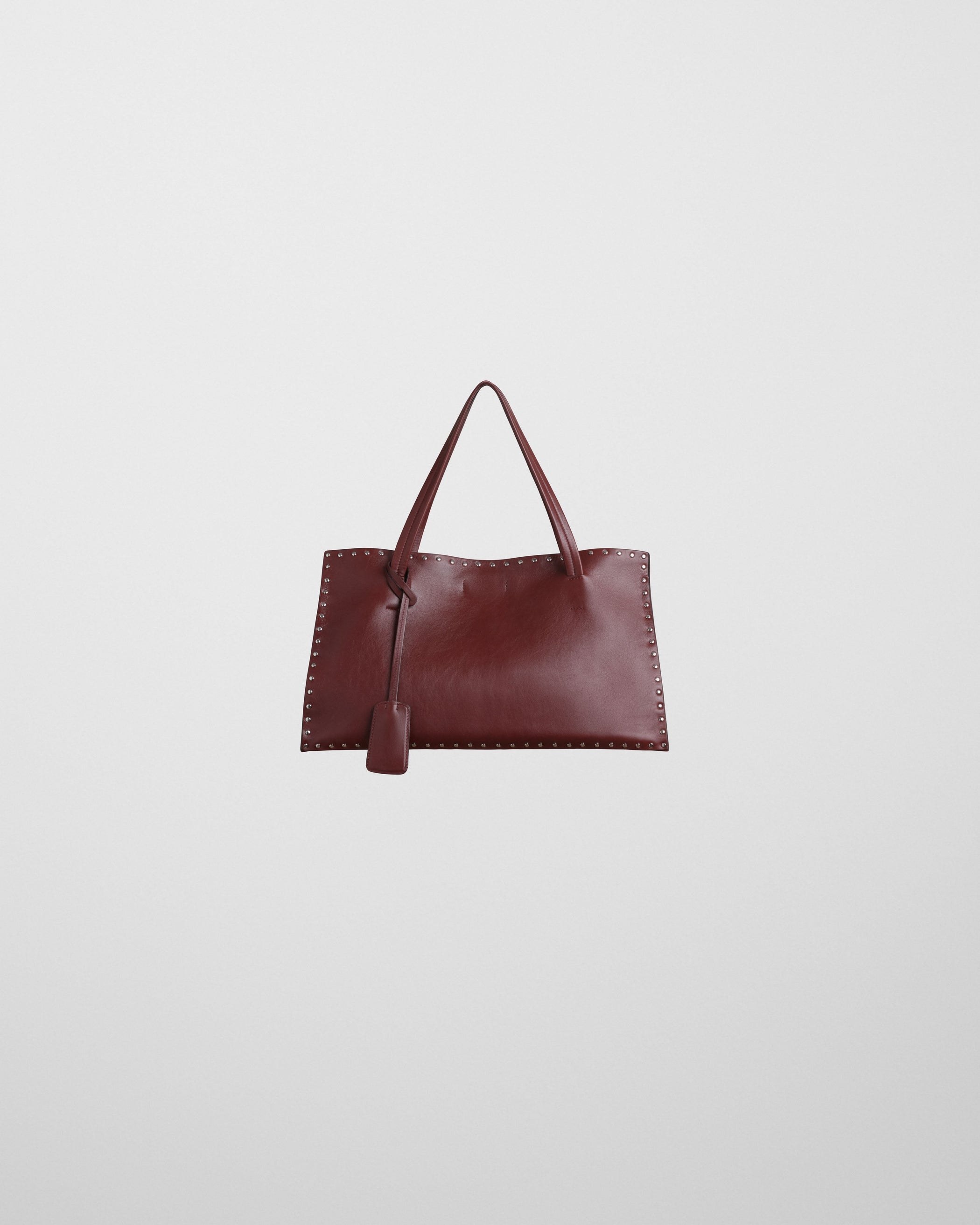 Flat front view of SMALL STUD CABAS in chestnut leather