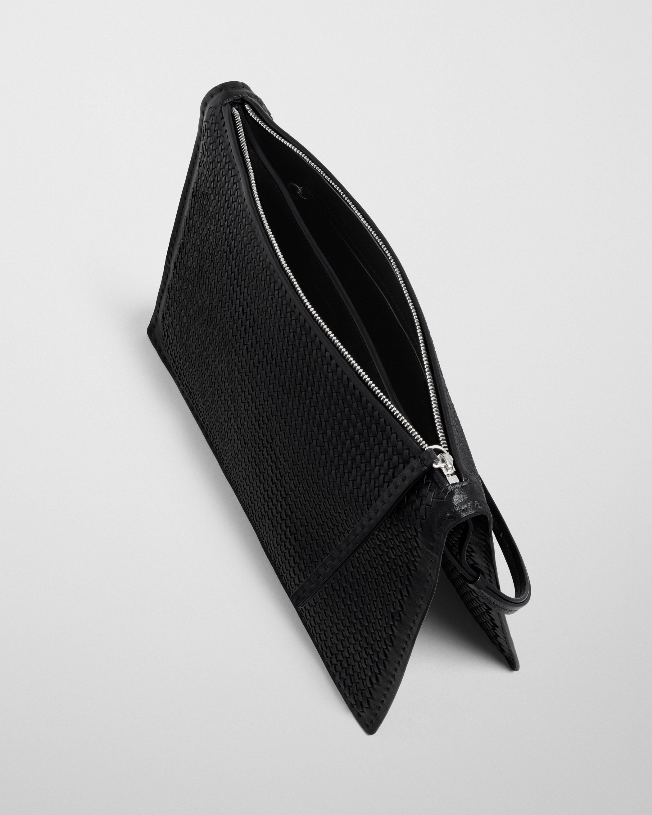Detail view of GLOVE POCHETTE in black woven leather