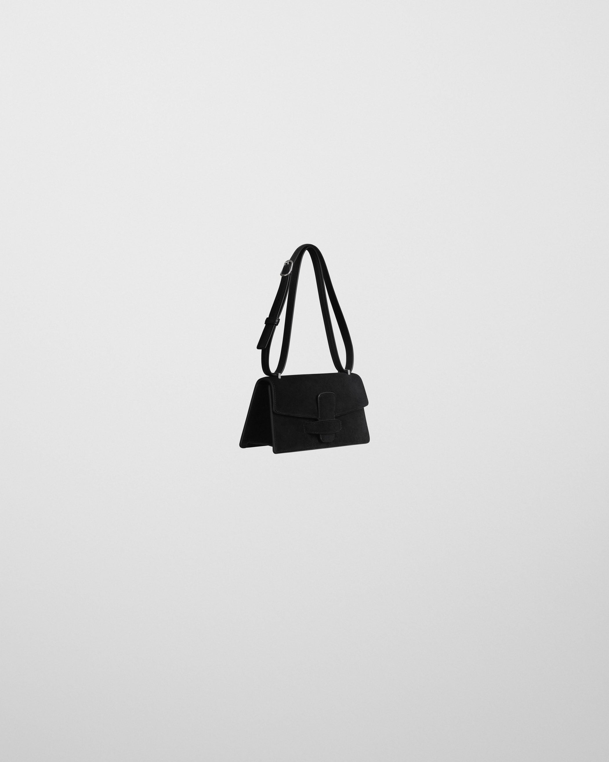 Angled side view of SMALL BAR BAG in black suede