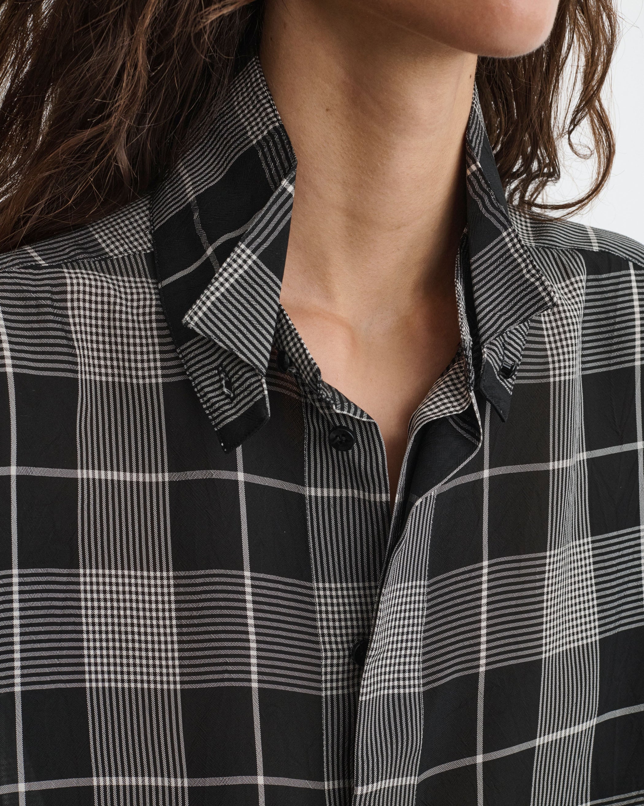 Collar detail view of model wearing CUSTOM TUX SHIRT in b/w check viscose