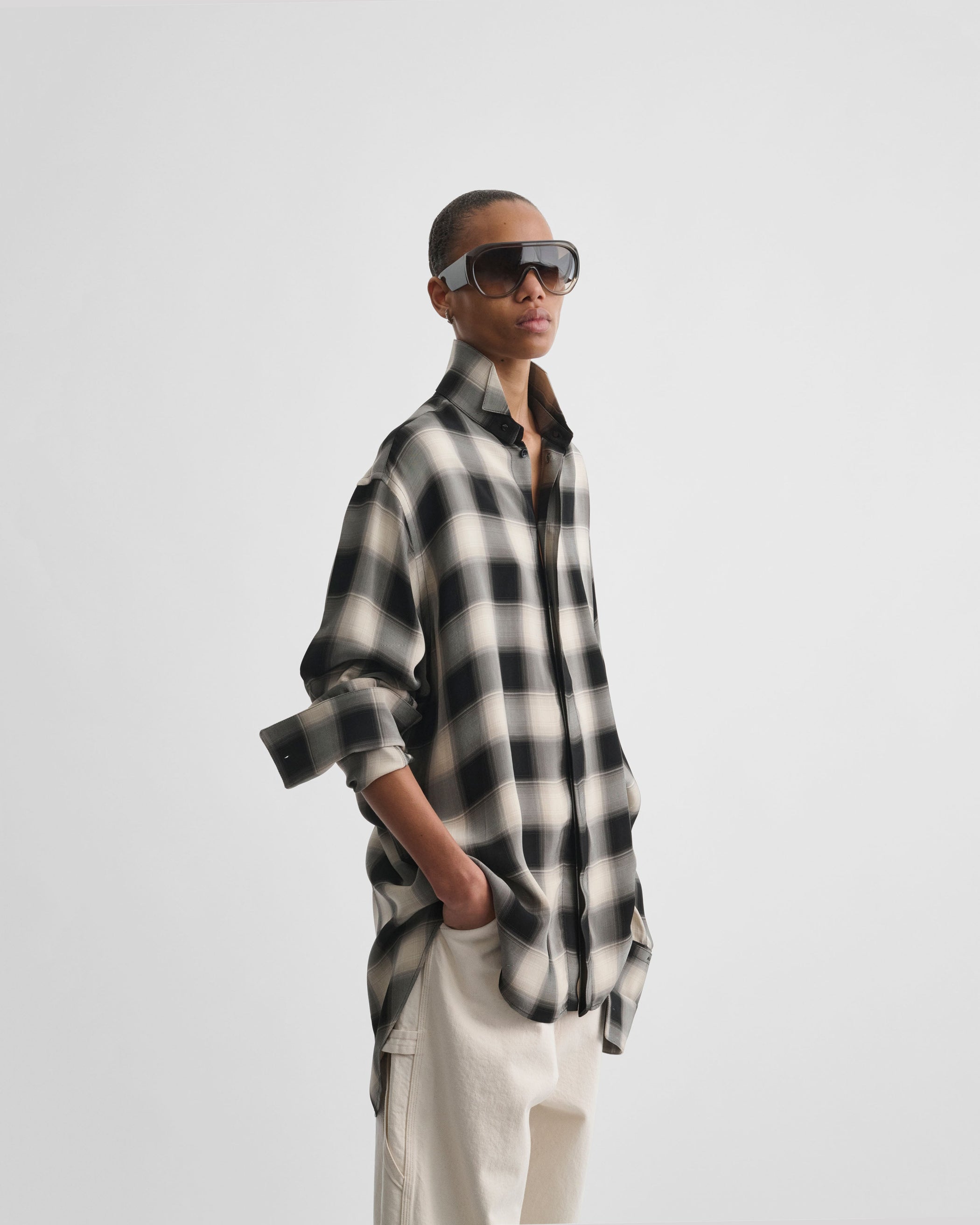 Angled front view of model wearing CUSTOM TUX SHIRT in b/b check viscose