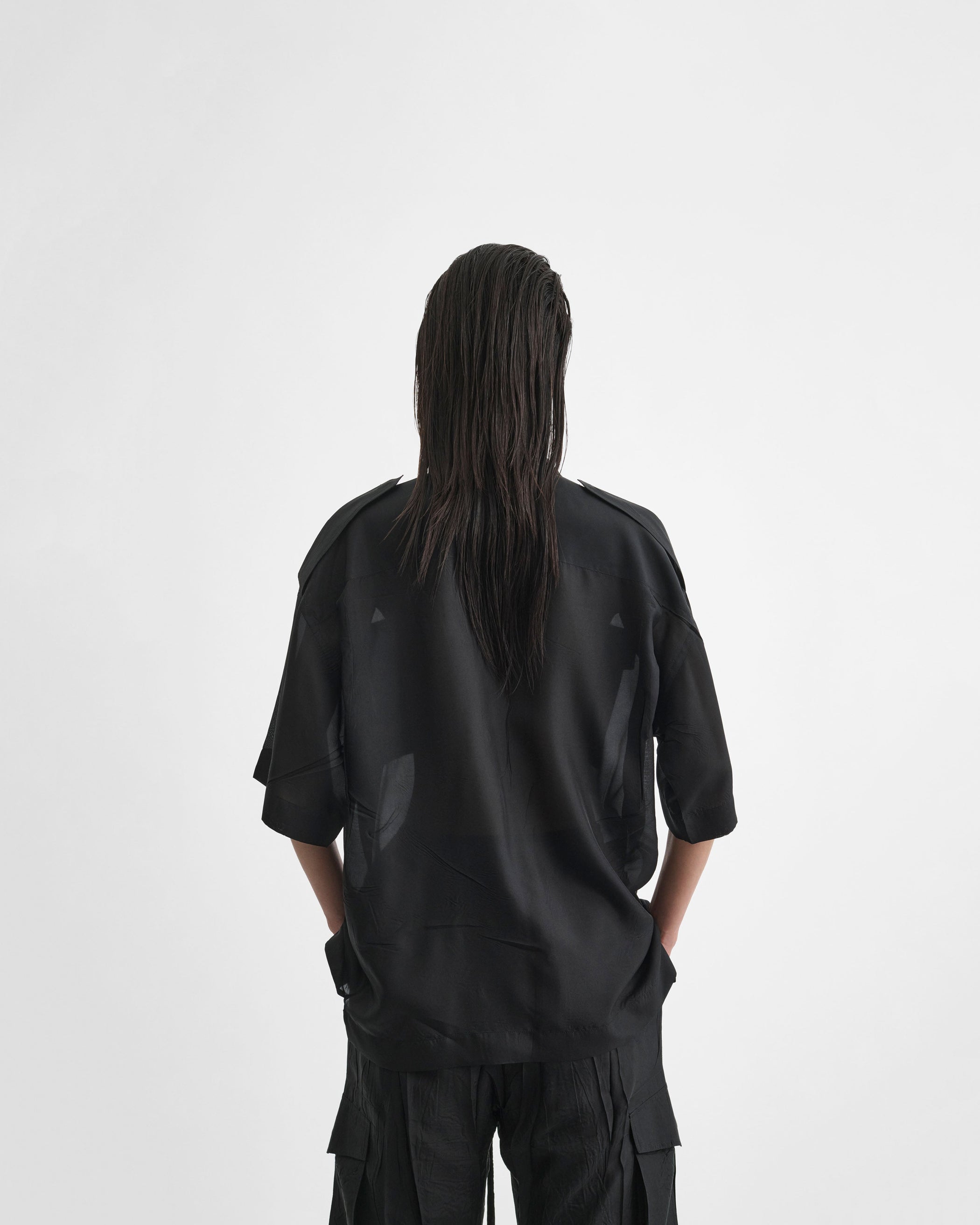 Back view of model wearing LITE UTILITY SHIRT in black habotai silk