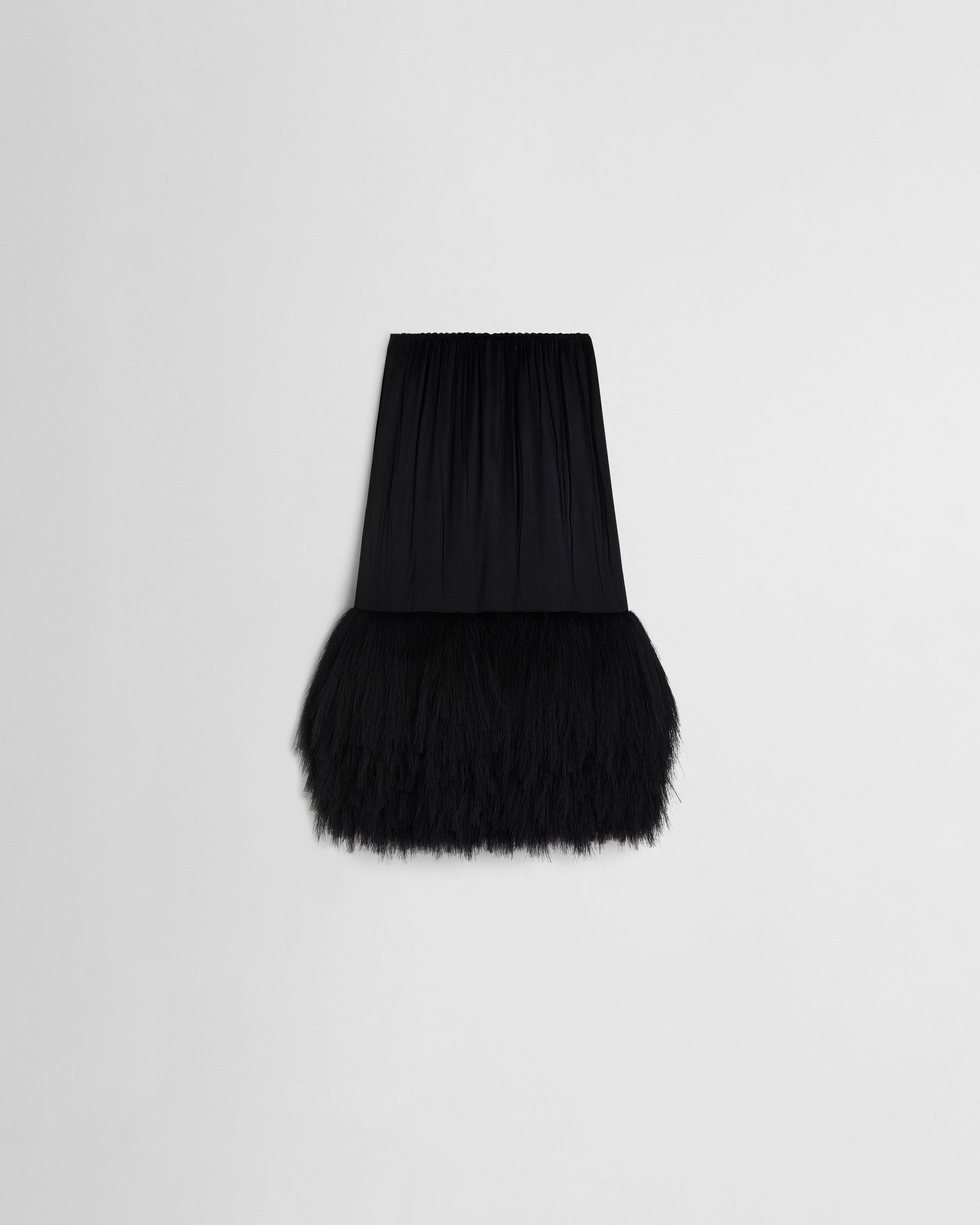 Flat back view of FRINGED SLIP SKIRT in black silk