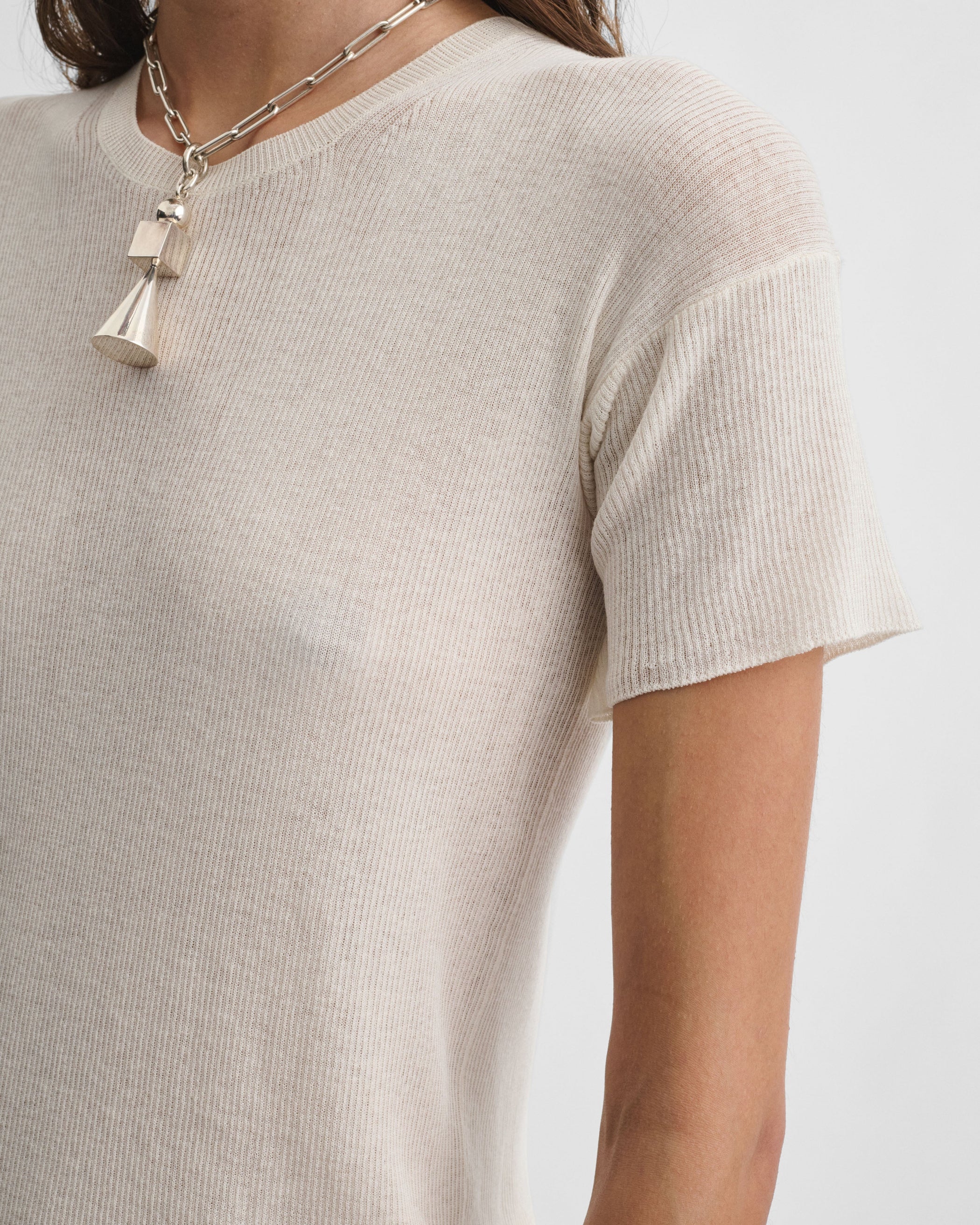 Detail view of model wearing SCOOP NECK RIB T-shirt in ivory cotton