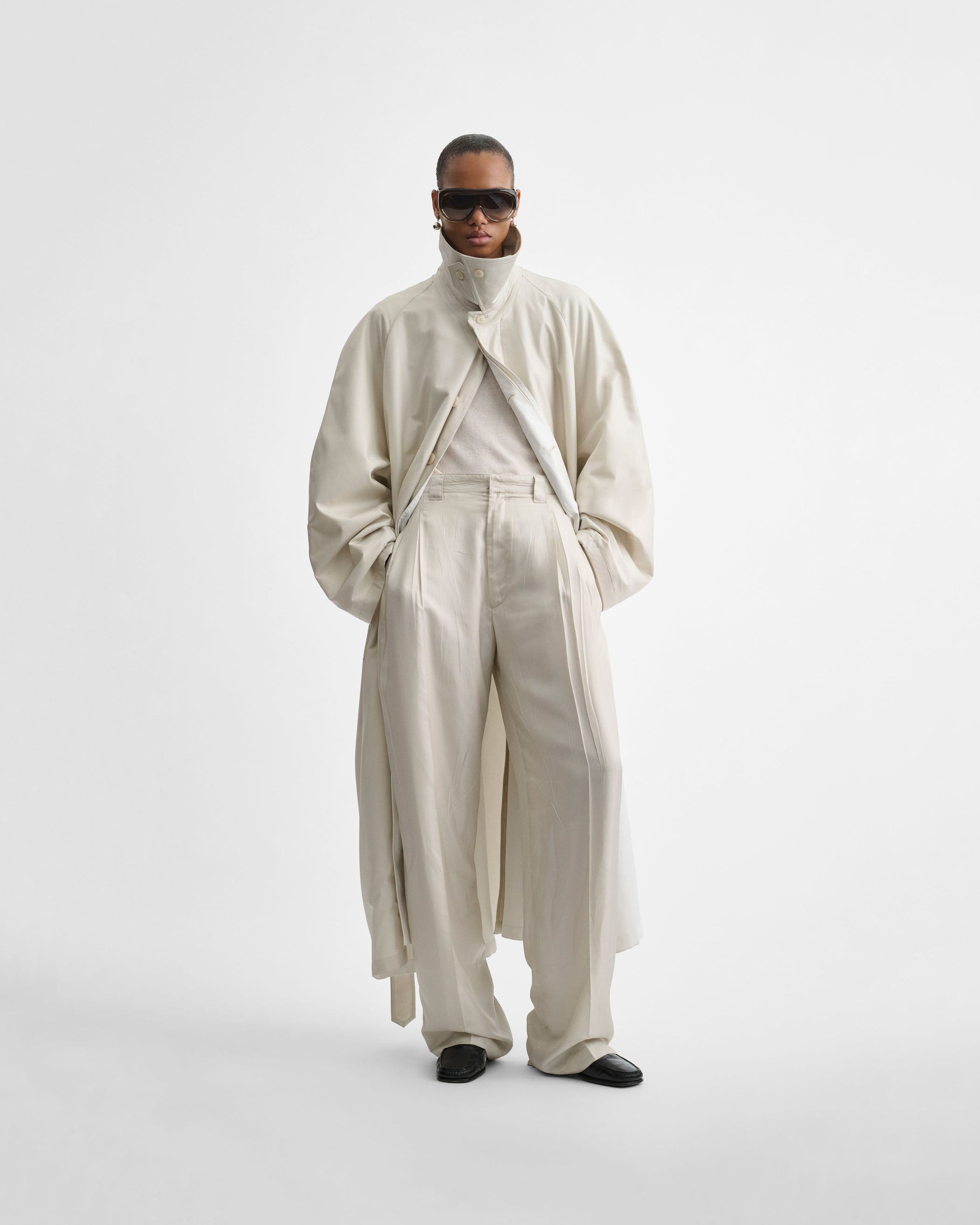 Front view of model wearing CHINO TROUSERS in salt technical twill