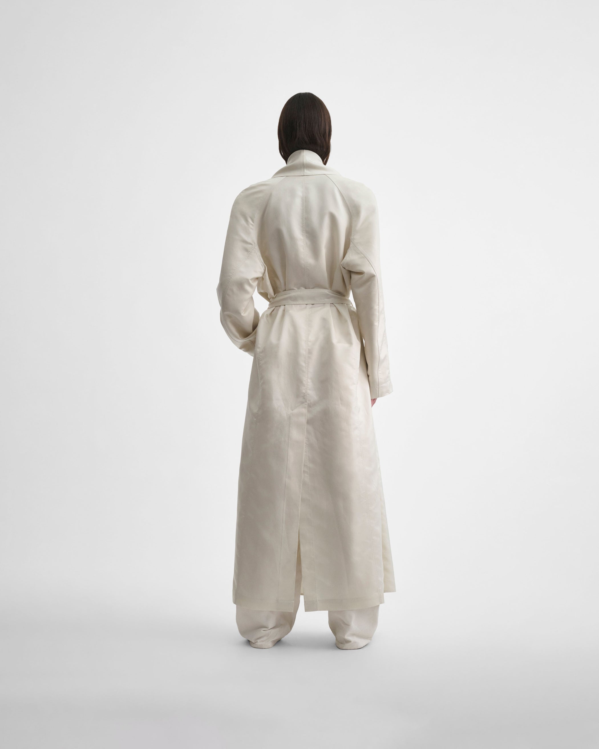 Back view of model wearing BELTED ROBE DRESS in salty white silk