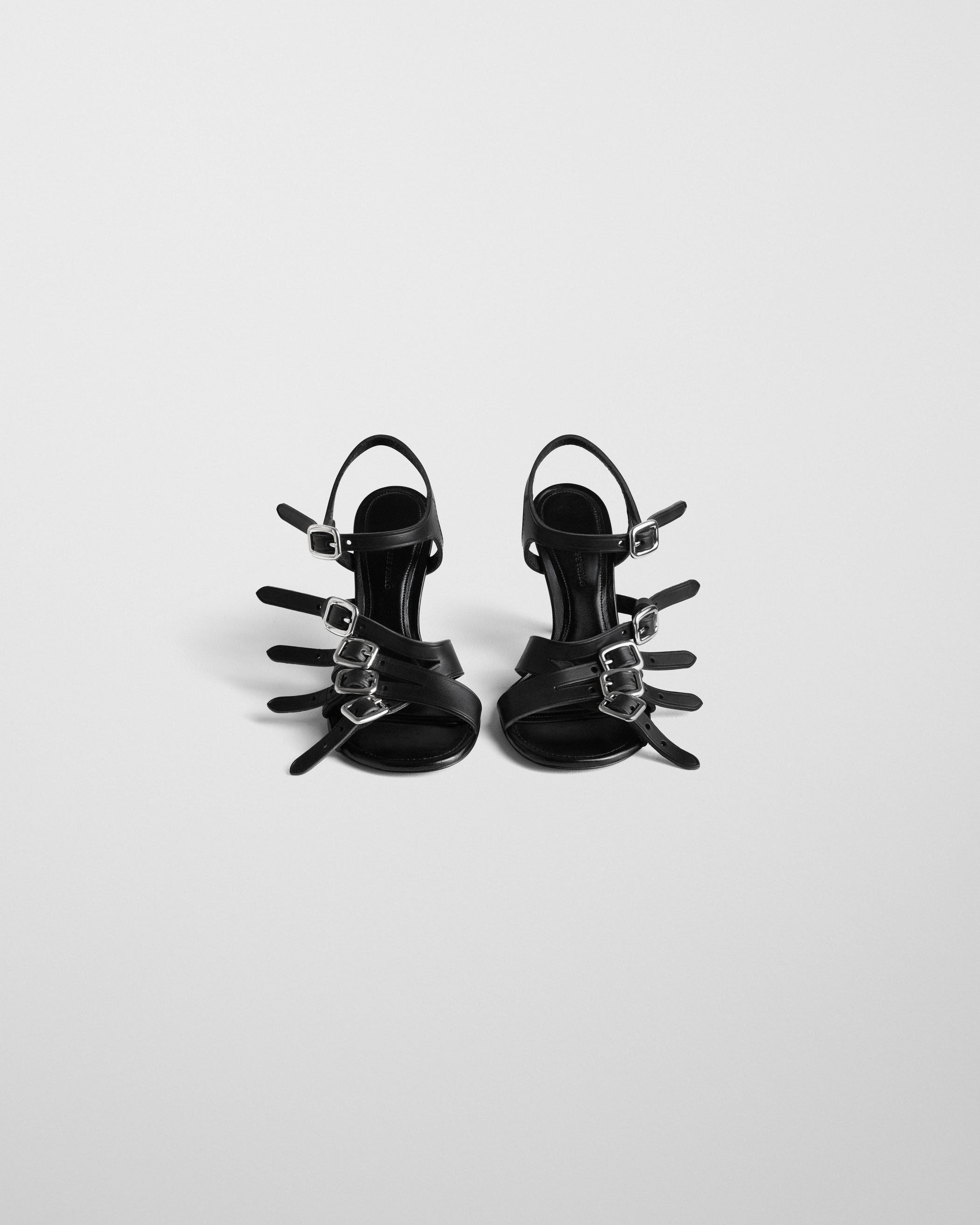 Front view of BUCKLE SANDAL in black leather