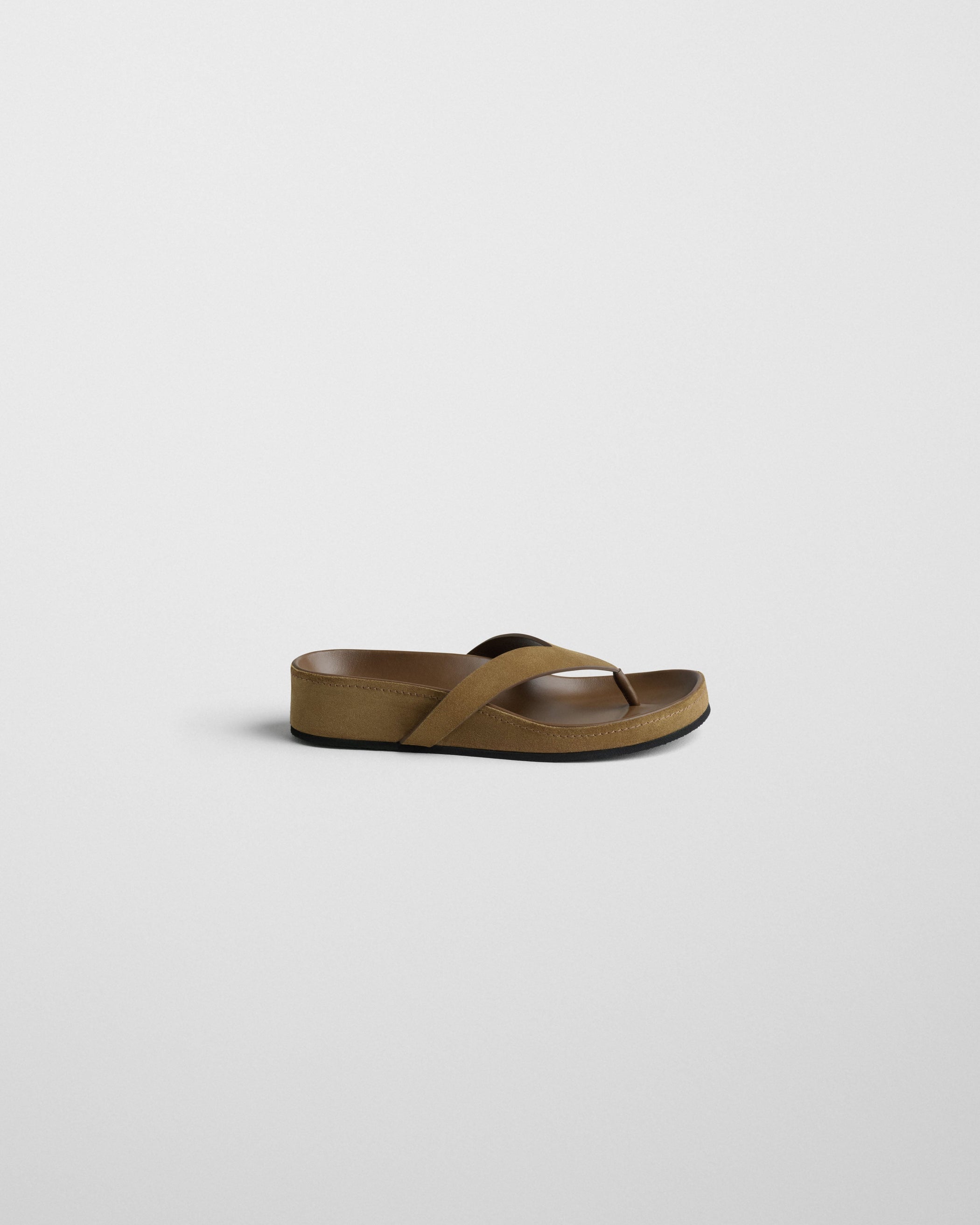 Side view of ROUND FLIP FLOP in caramel suede