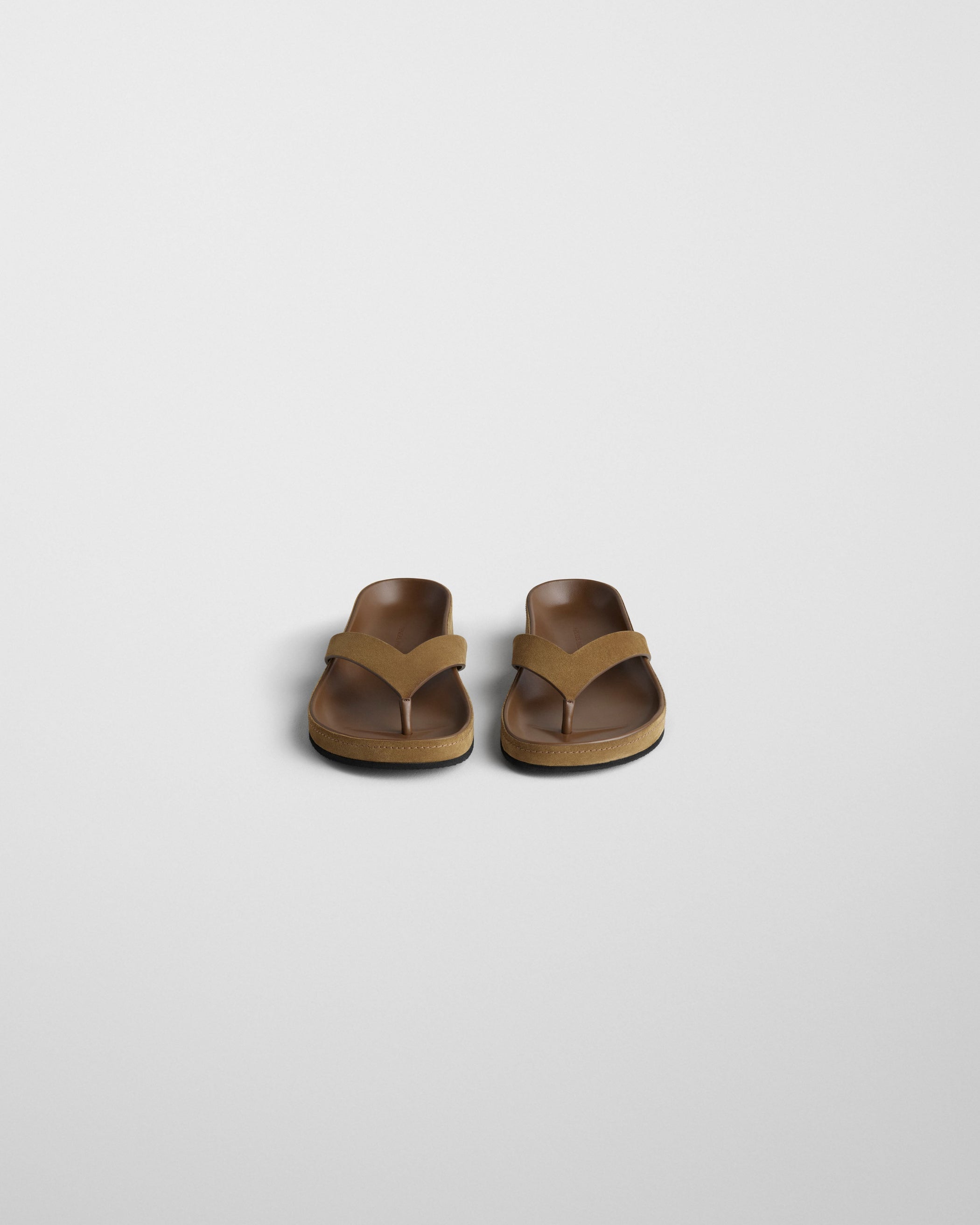 Front view of ROUND FLIP FLOP in caramel suede