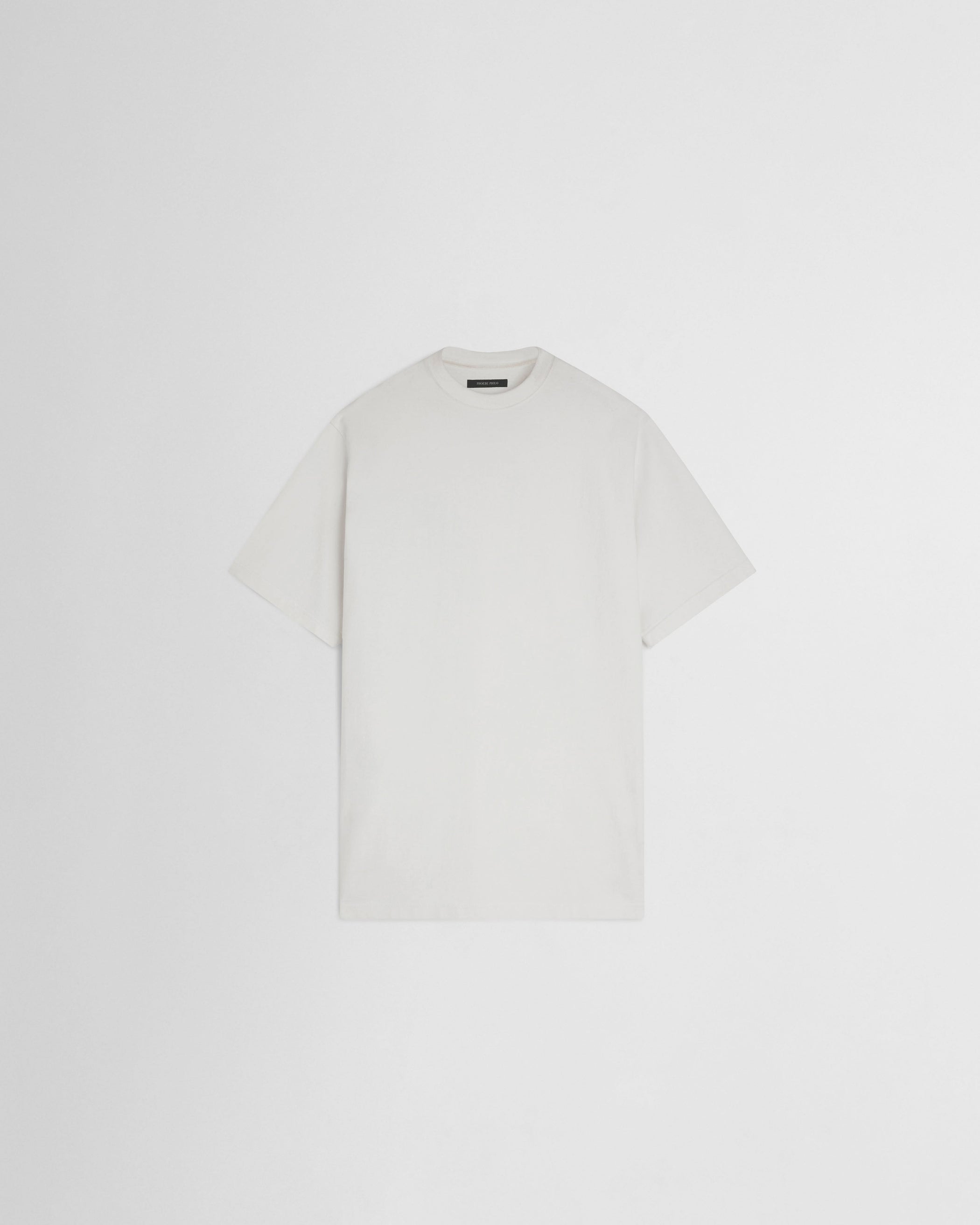 Flat front view of BIG T in white cotton