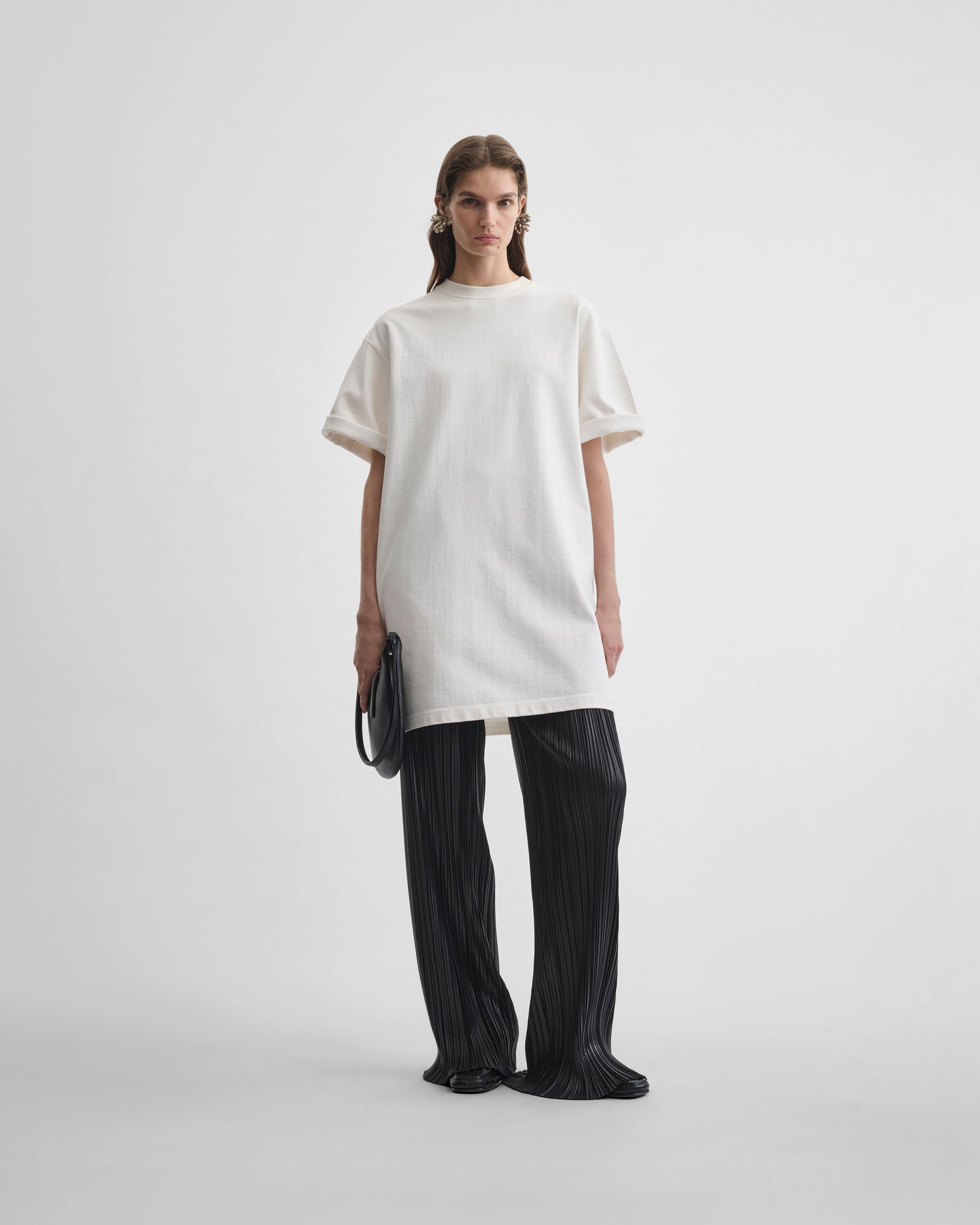 Front view of model wearing BIG T in white cotton