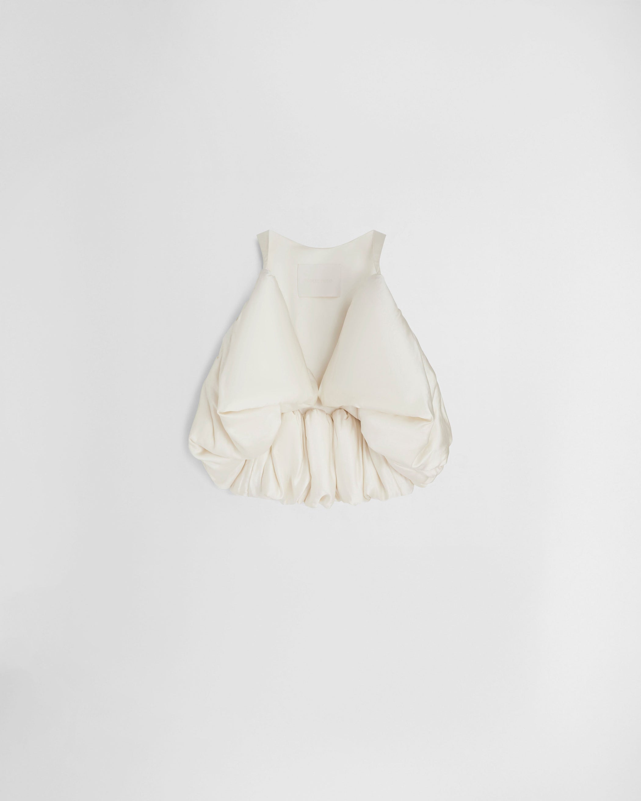 Flat back view of SUGAR VEST in vanilla silk satin