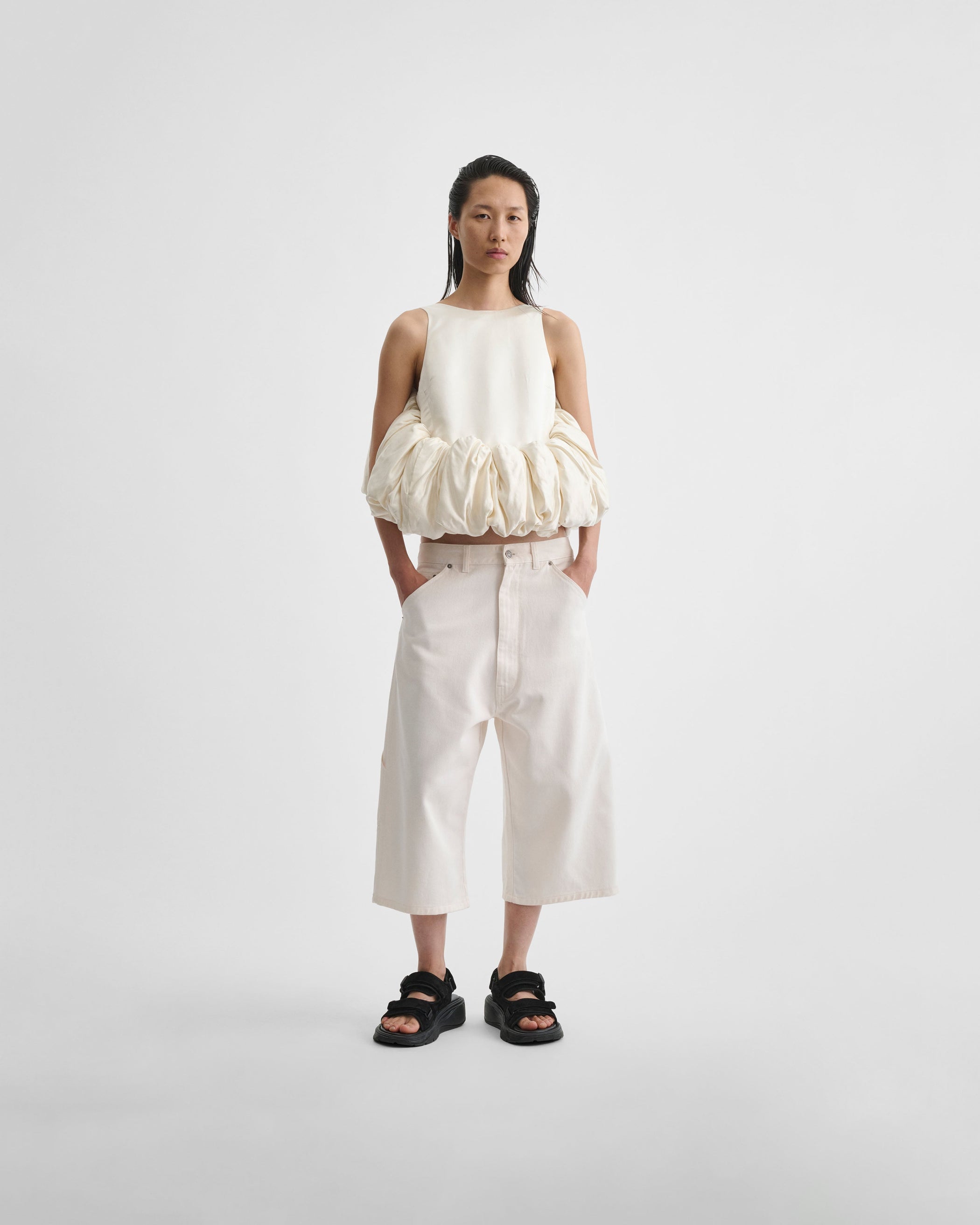 Front view of model wearing SUGAR VEST in vanilla silk satin