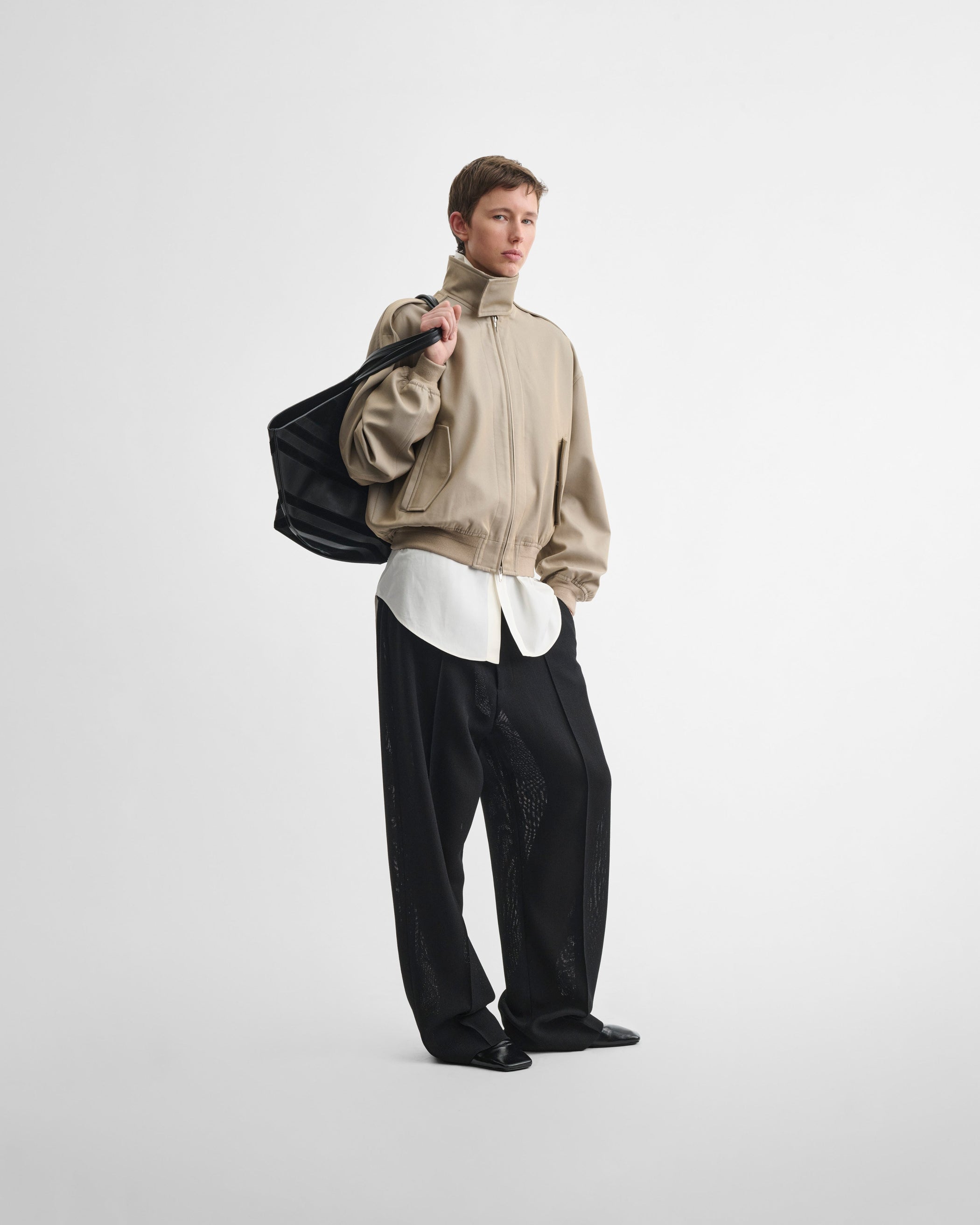 Front view of model wearing the HARRINGTON JACKET in desert cotton