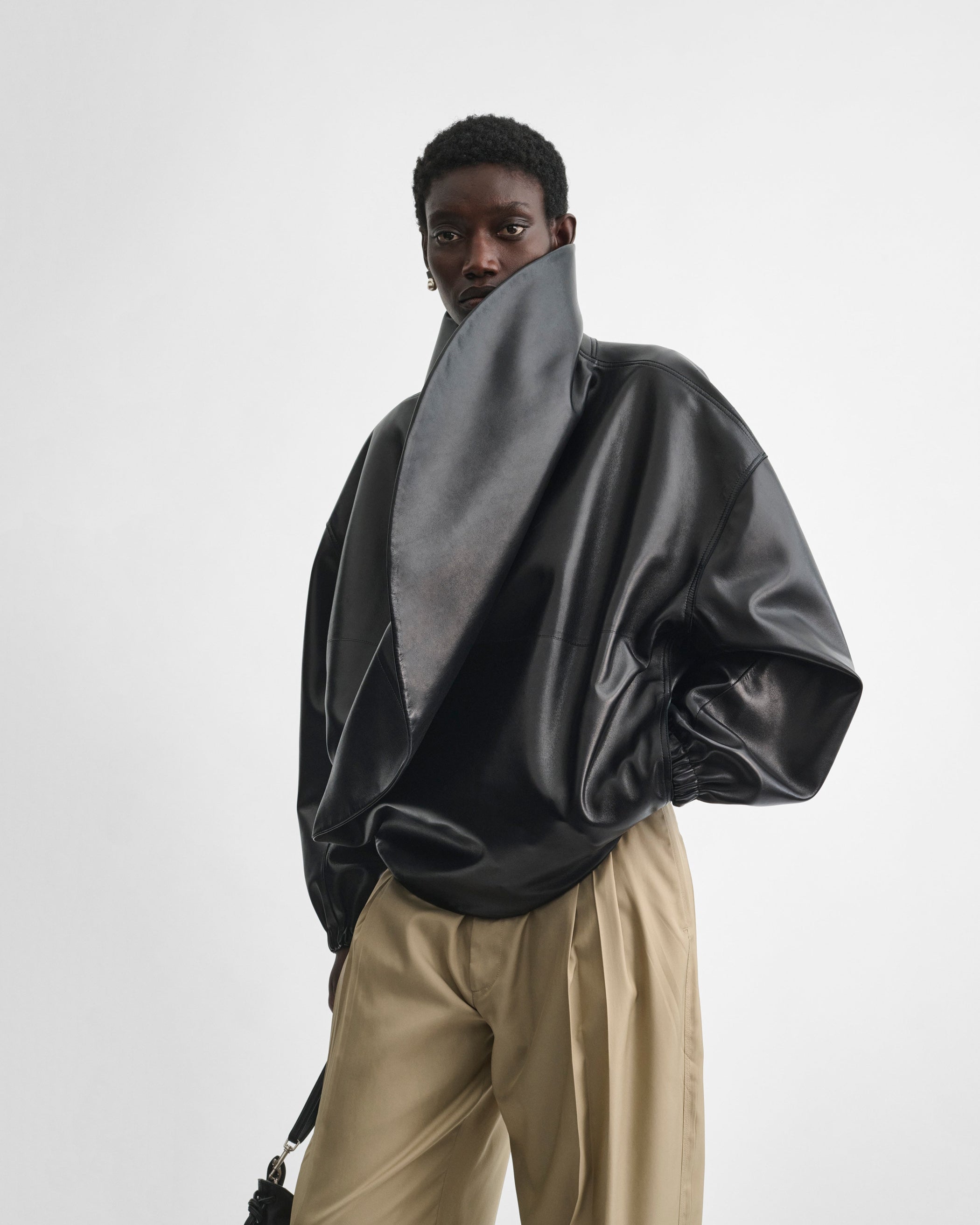 Front view of model wearing the MOON BOMBER in black leather