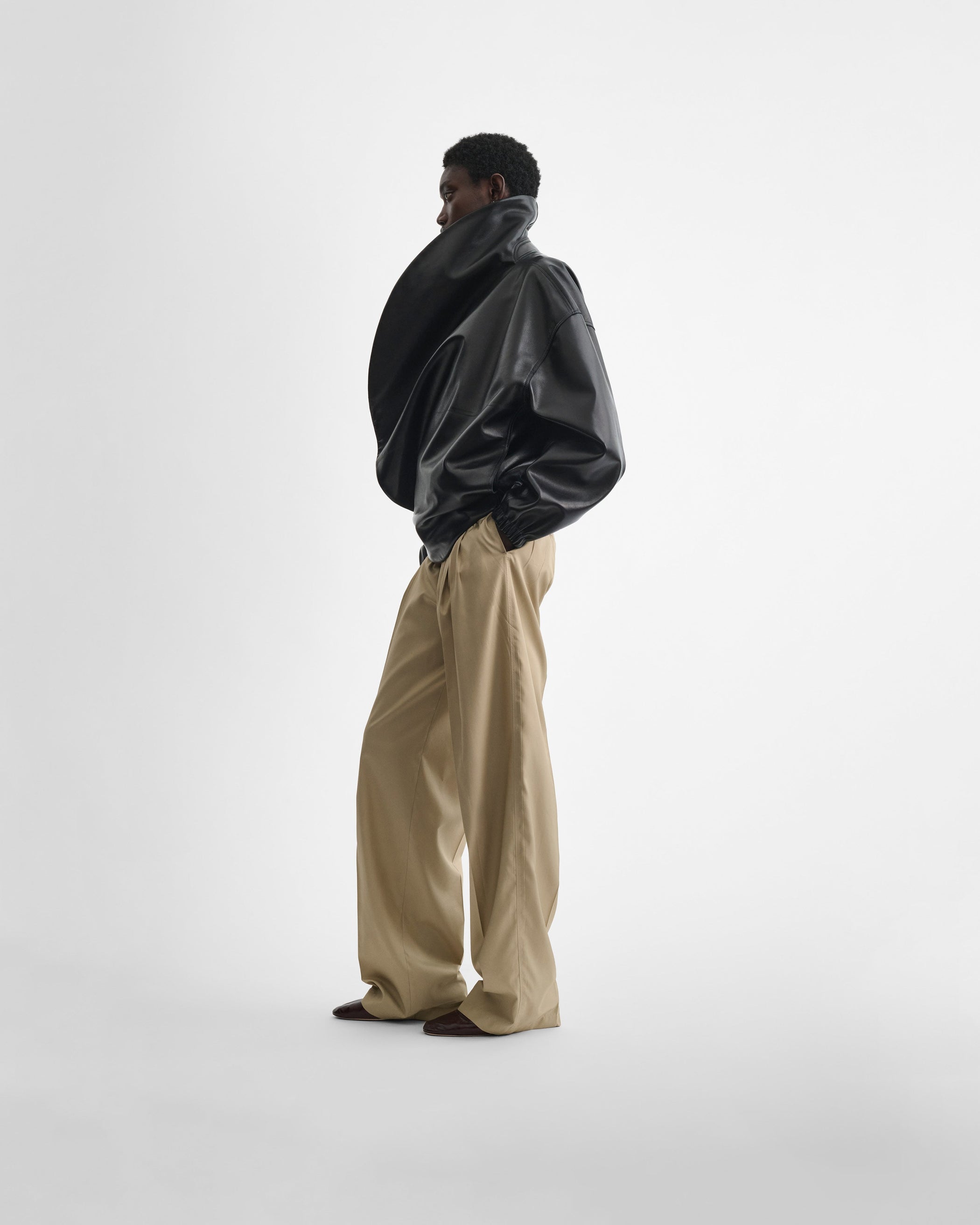 Front full length view of model wearing the MOON BOMBER in black leather